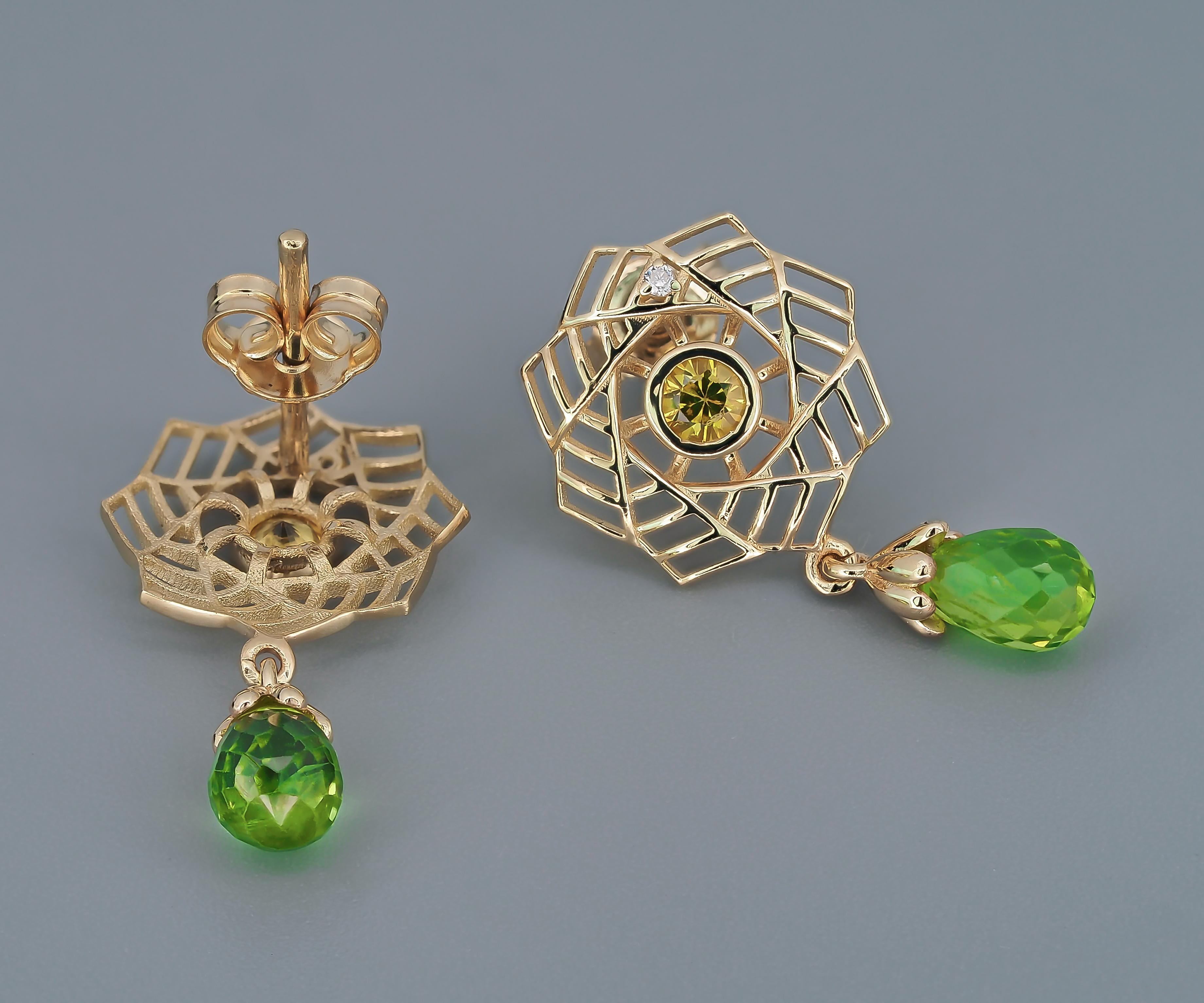 Modern 14k gold earrings with peridots, sapphires and diamonds.  For Sale