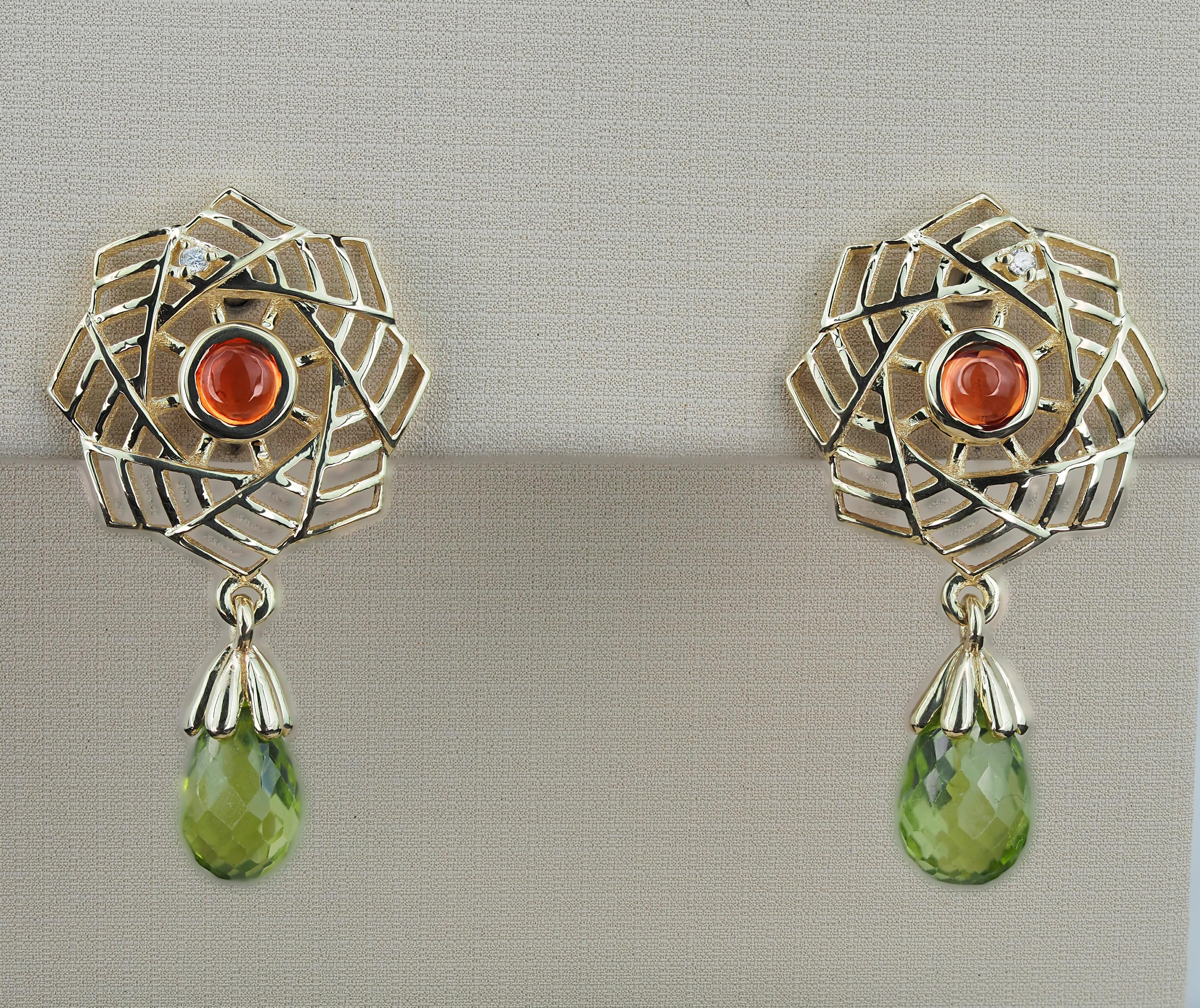 Modern 14k gold earrings with peridots, sapphires and diamonds.  For Sale