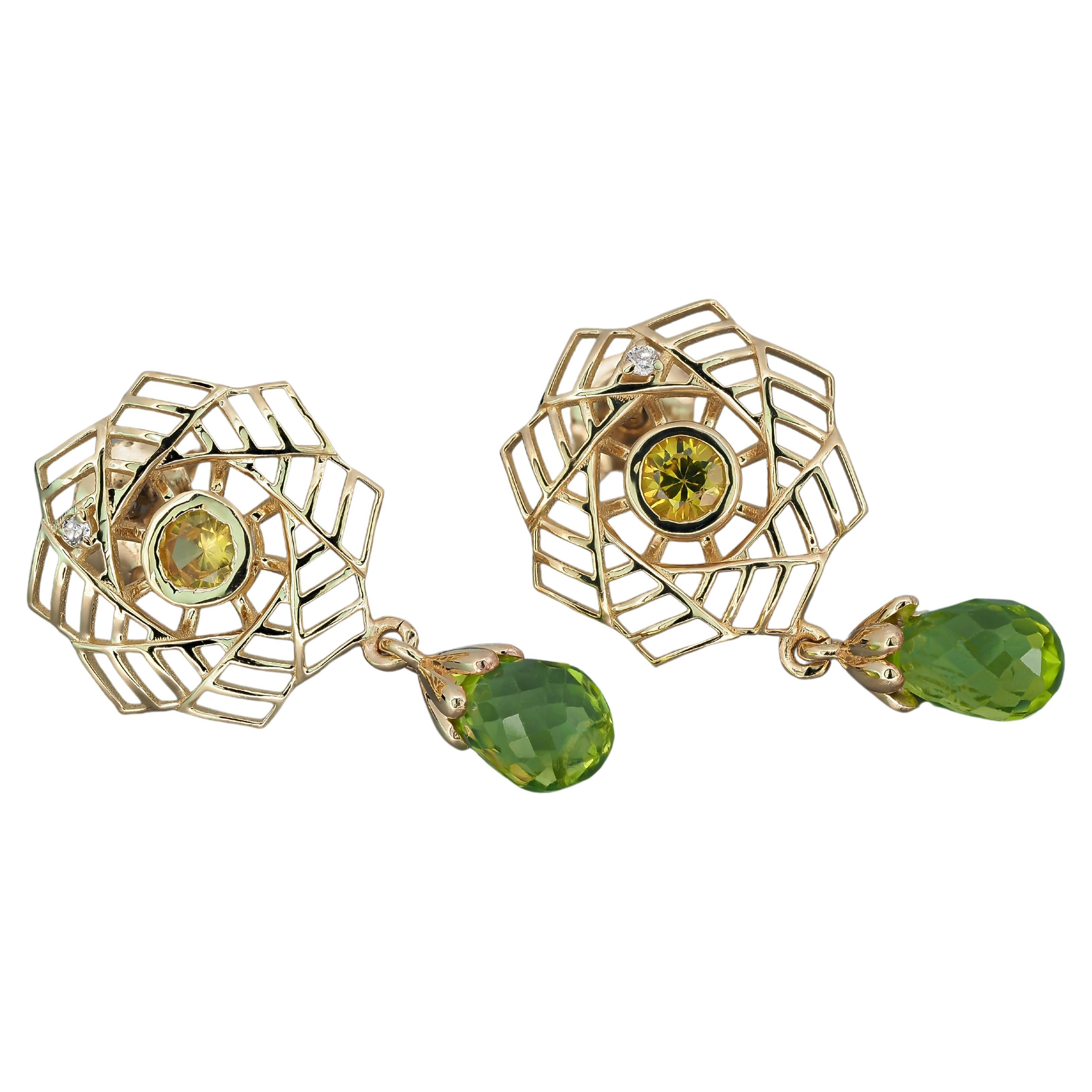 14k gold earrings with peridots, sapphires and diamonds.  For Sale