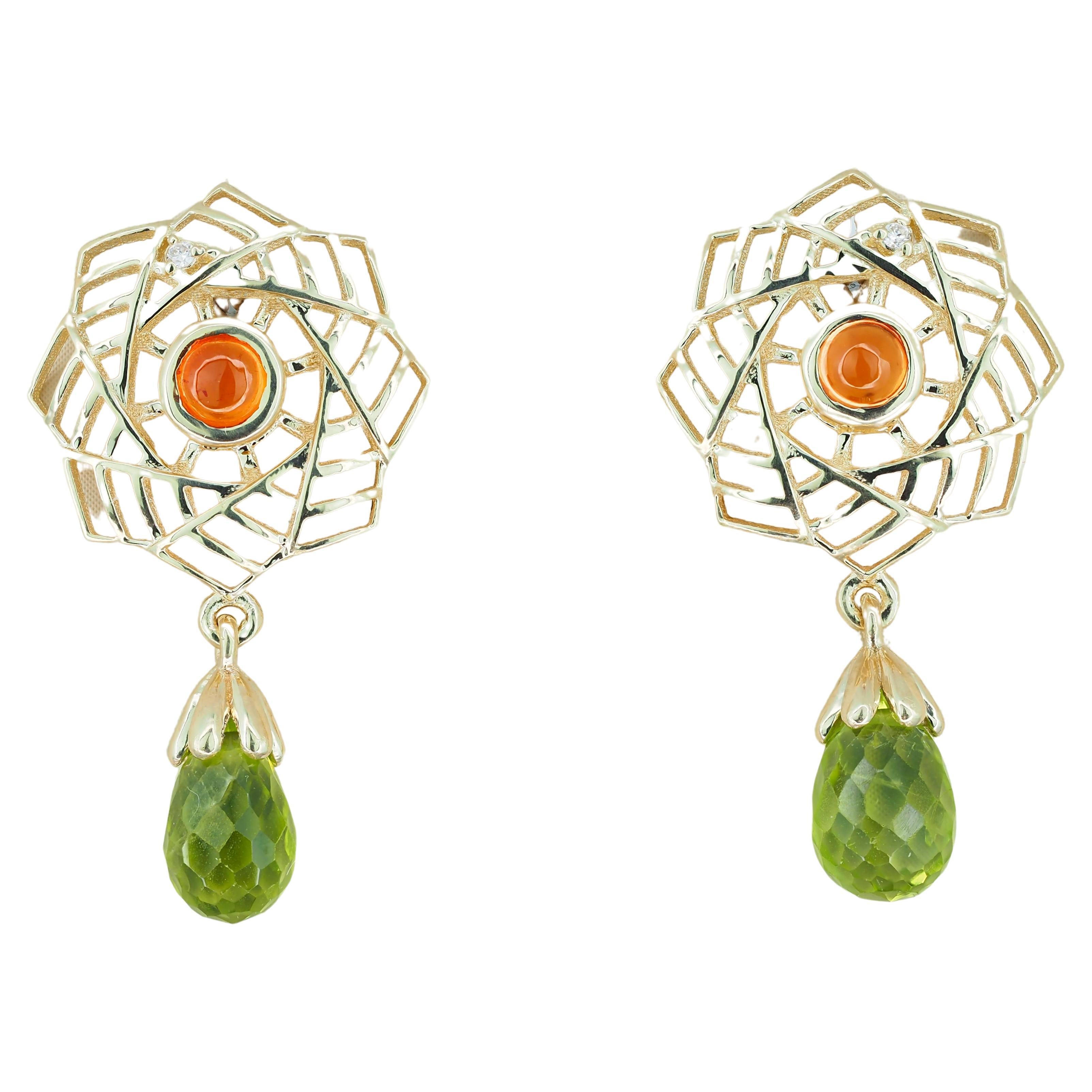14k gold earrings with peridots, sapphires and diamonds.  For Sale