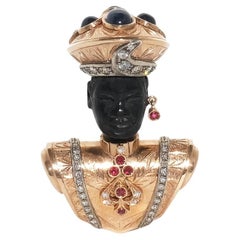 Brosche aus 14 Karat Gold, Ebenholz, Saphiren, Rubinen und Diamanten