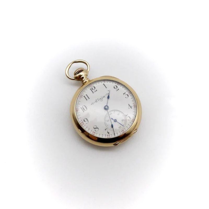 This Edwardian pocket watch is a treasure that dates to 1904. It is an Elgin watch in excellent working condition, with beautiful detail and intricate mechanical design. The attractive case is 14k gold, with the monogram EBC engraved on the back.