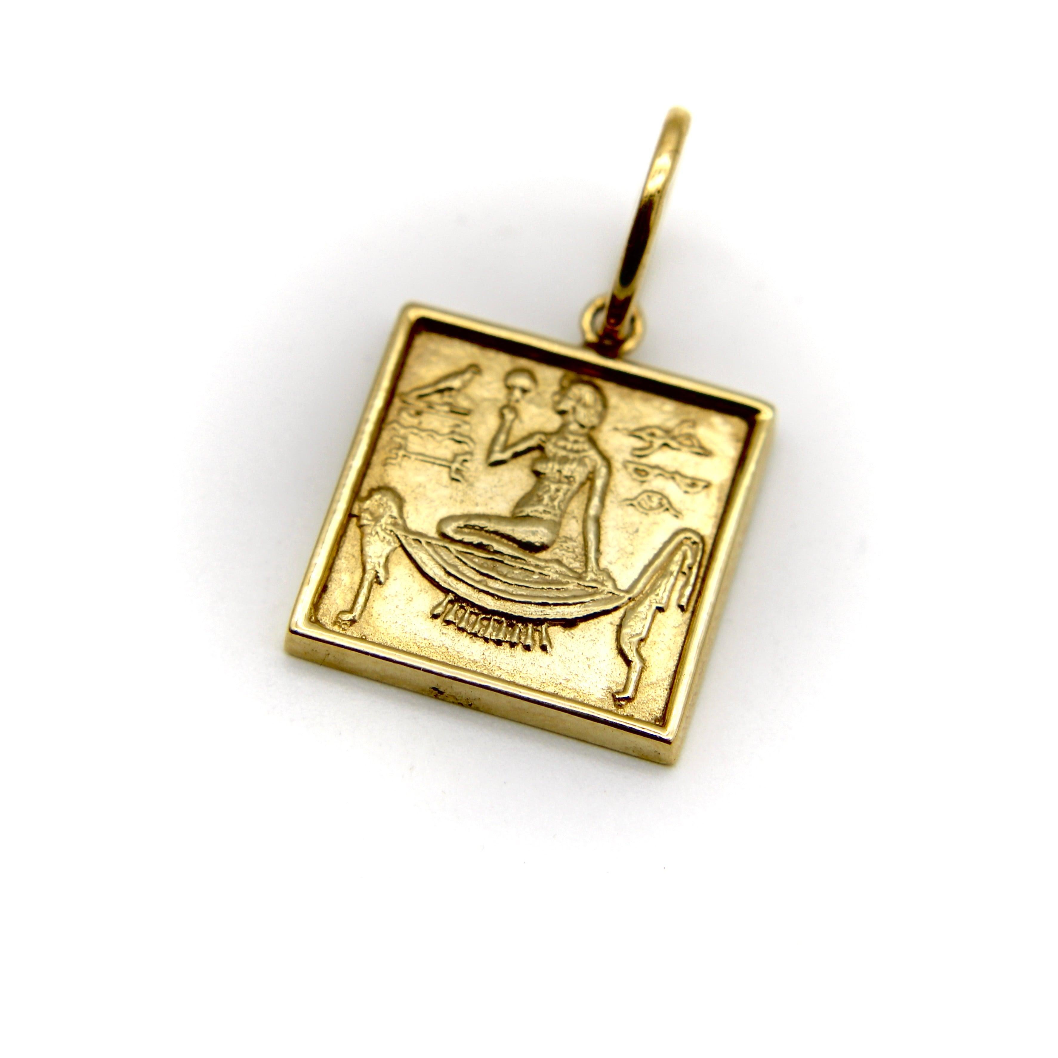 Part of our Cute as a Button Collection, Kirsten’s Corner created this charm by using a 1920’s button as a mold, and casting the piece in 14k gold. The button has a wonderful Egyptian Revival design: a goddess is pictured being lifted on a doglike,