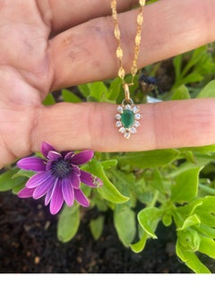 14 Karat Gold Smaragd- und Diamant-Anhänger .80 TCW