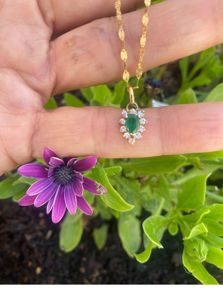The pendant is a Tear-drop, Emerald, and Diamond necklace suspended by a fancy gold chain.

The total gemstone weight is a combined  .80 Carat.


The emerald is an excellent quality 6 x 4 mm, pear-shaped stone estimated to weigh .50 carat.

The