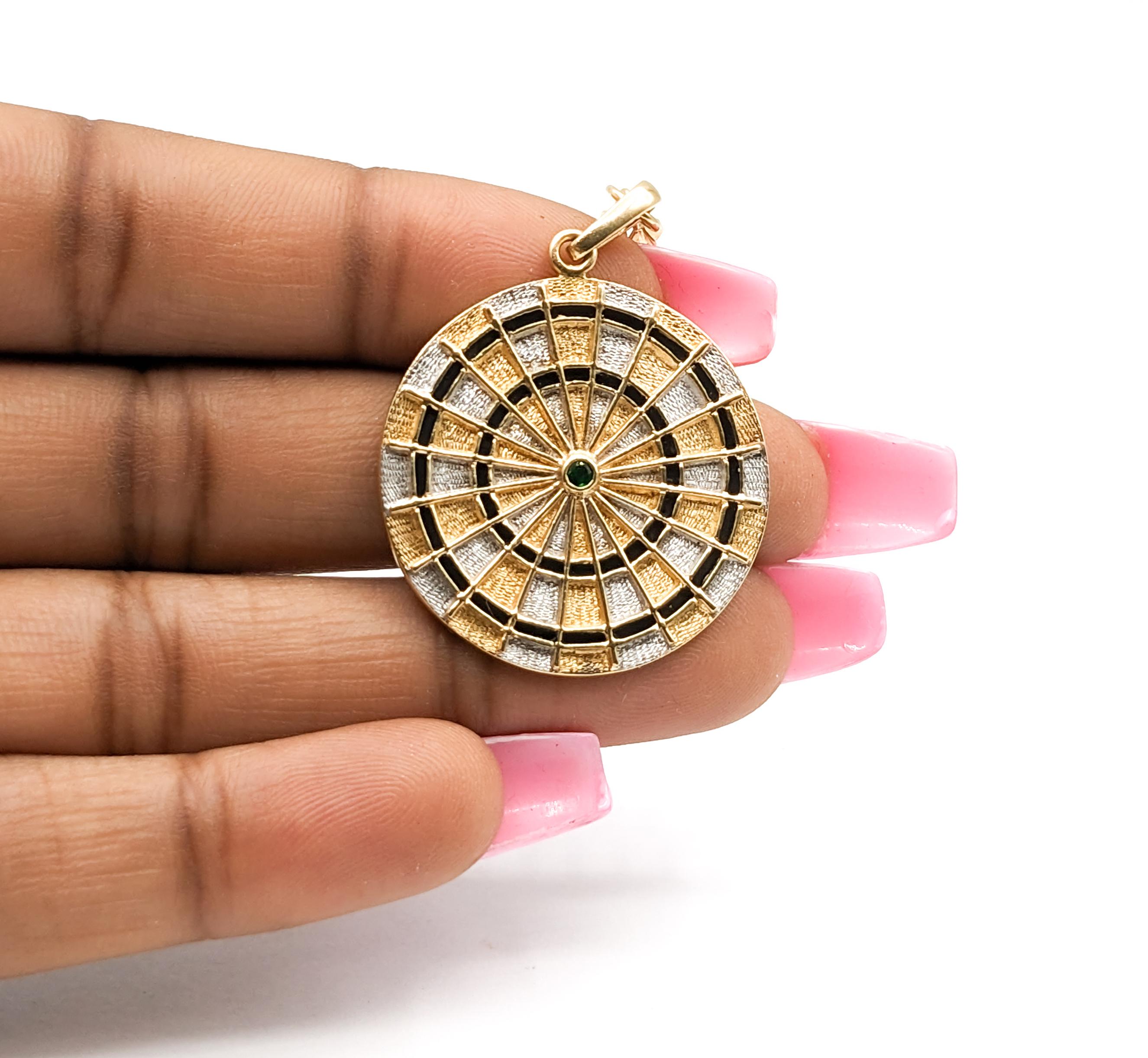 14K Gold, Emerald & Enamel Dartboard Pendant

This distinctive pendant, masterfully crafted in a blend of 14kt white and yellow gold, showcases a captivating round-cut emerald at its core, set against a striking enamel 