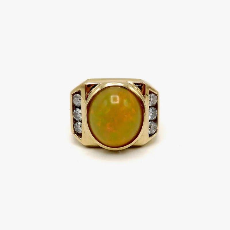 This striking cocktail ring features an oval-shaped Ethiopian opal cabochon and six full-cut diamonds set in 14k yellow gold. It’s a great unisex ring with a bold, geometric design. The lattice work on the inside of the band allows for a large ring