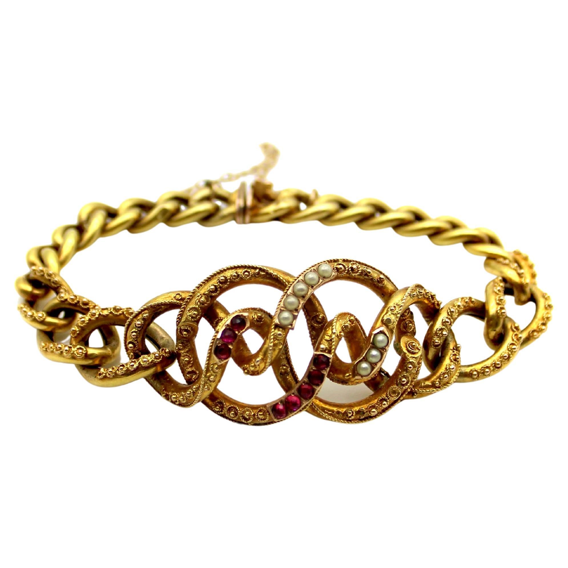 14K Gold Etruscan Revival Lover’s Knot Bracelet with Garnets and Pearls For Sale