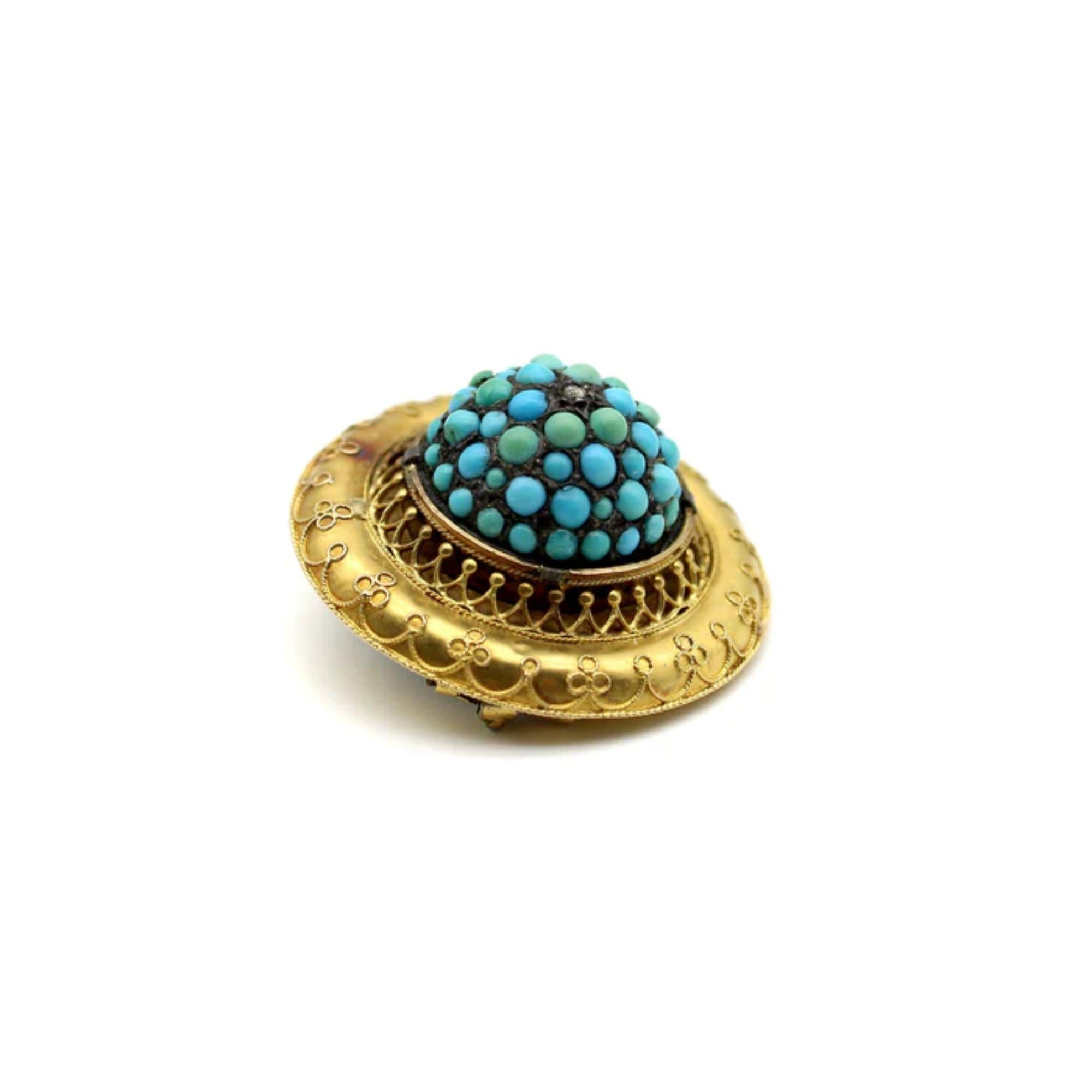 This is a gorgeous 14k gold, turquoise, and diamond brooch, made in the Etruscan Revival style of the 1870's. It has a three dimensional dome at its center, which is covered in turquoise cabochons of different sizes and shades, and accented at the