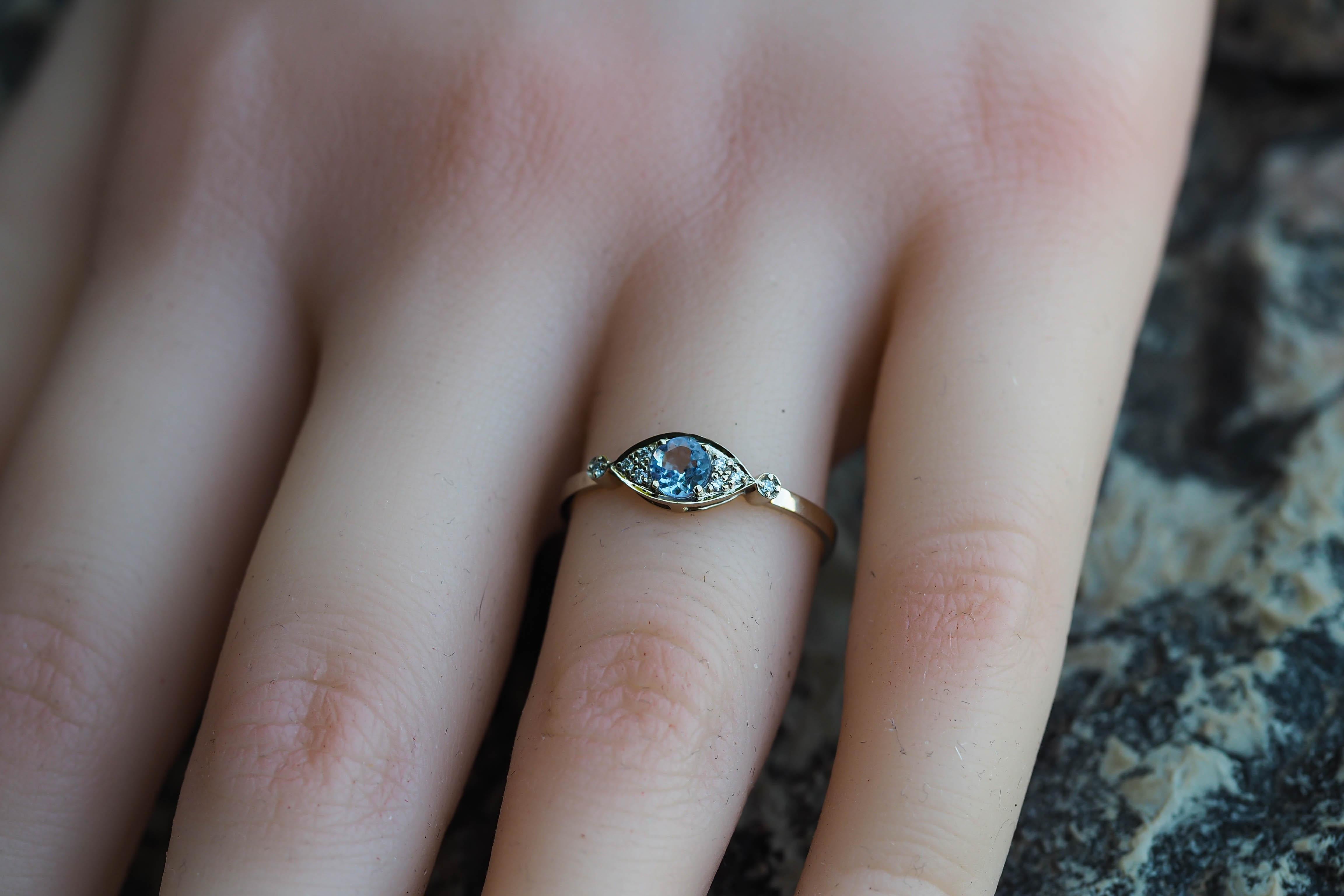 Im Angebot: 14 Karat Gold Ring „Eye“ mit Tansanit und Diamanten () 14