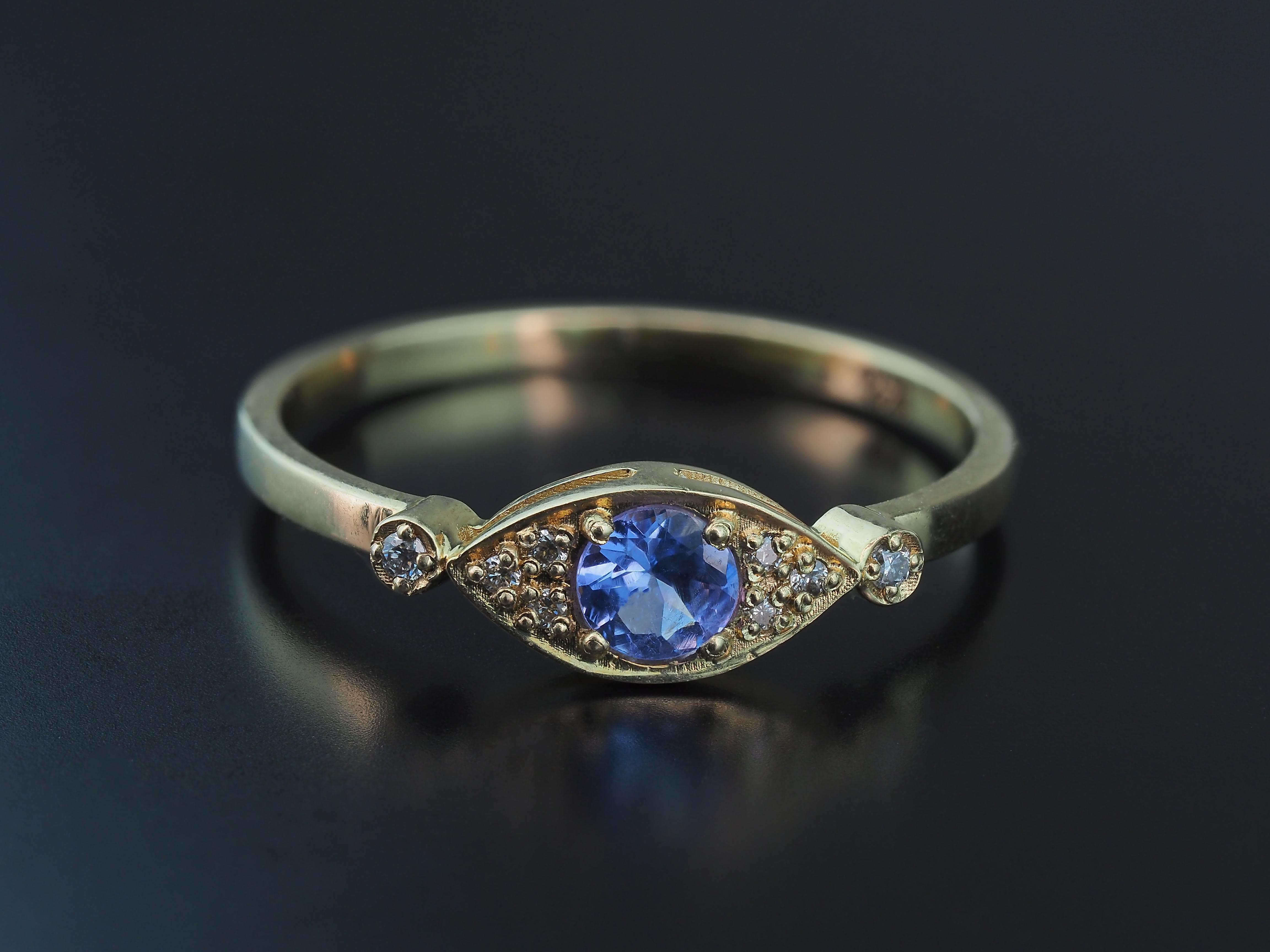 For Sale:  Evil eye tanzanite 14k gold ring 8