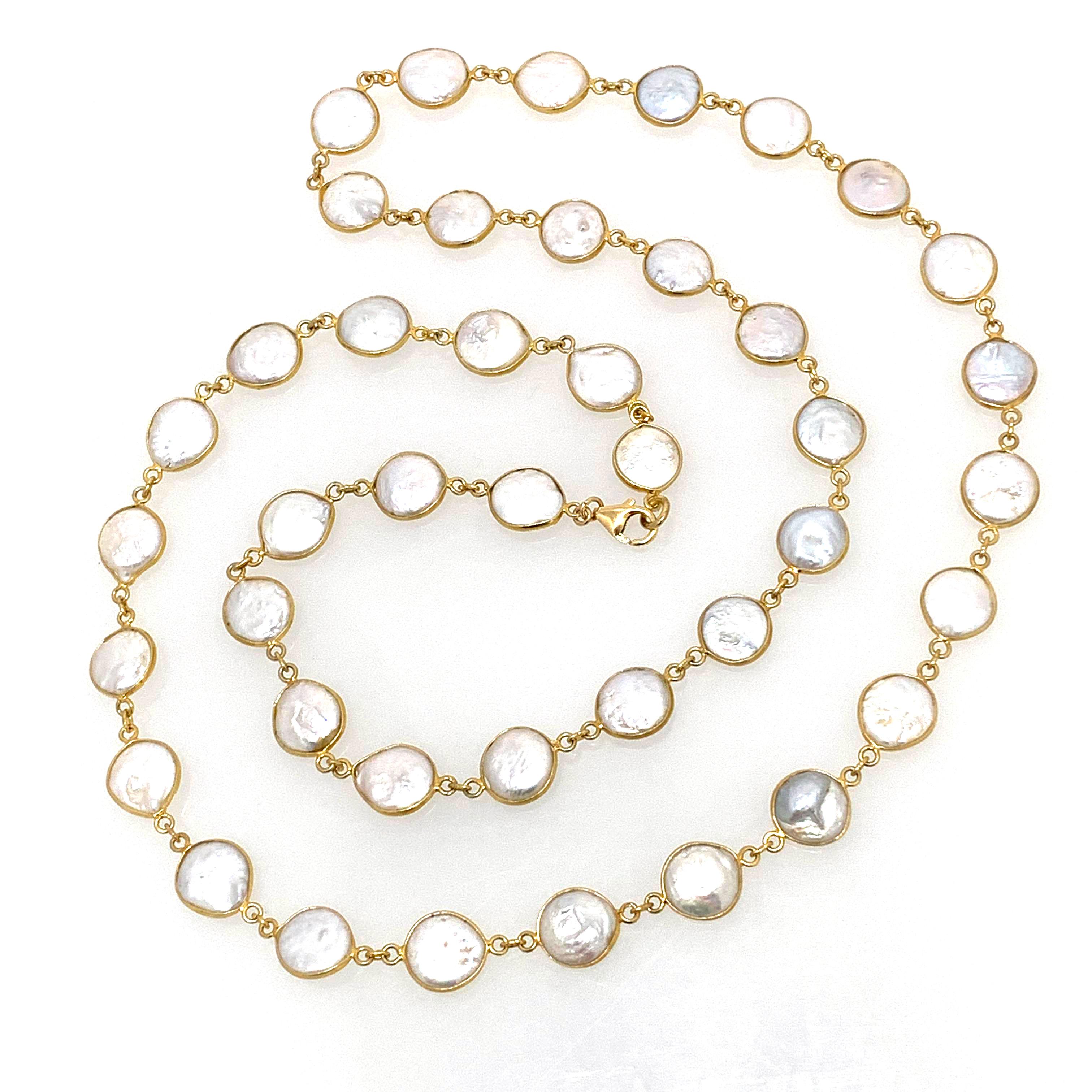 This bezel-set coin pearl long necklace is such a beautiful piece! 

This long and elegant necklace features 42 pcs of unique shape and lustrous genuine cultured coin pearls. Each pearl measures 12-13mm (1/2