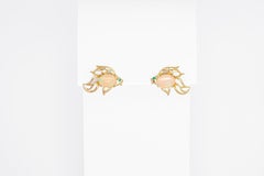 14k gold Fish earrings studs set in 14k gold.