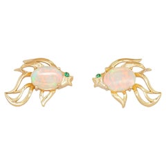 14k gold Fish earrings studs set in 14k gold.