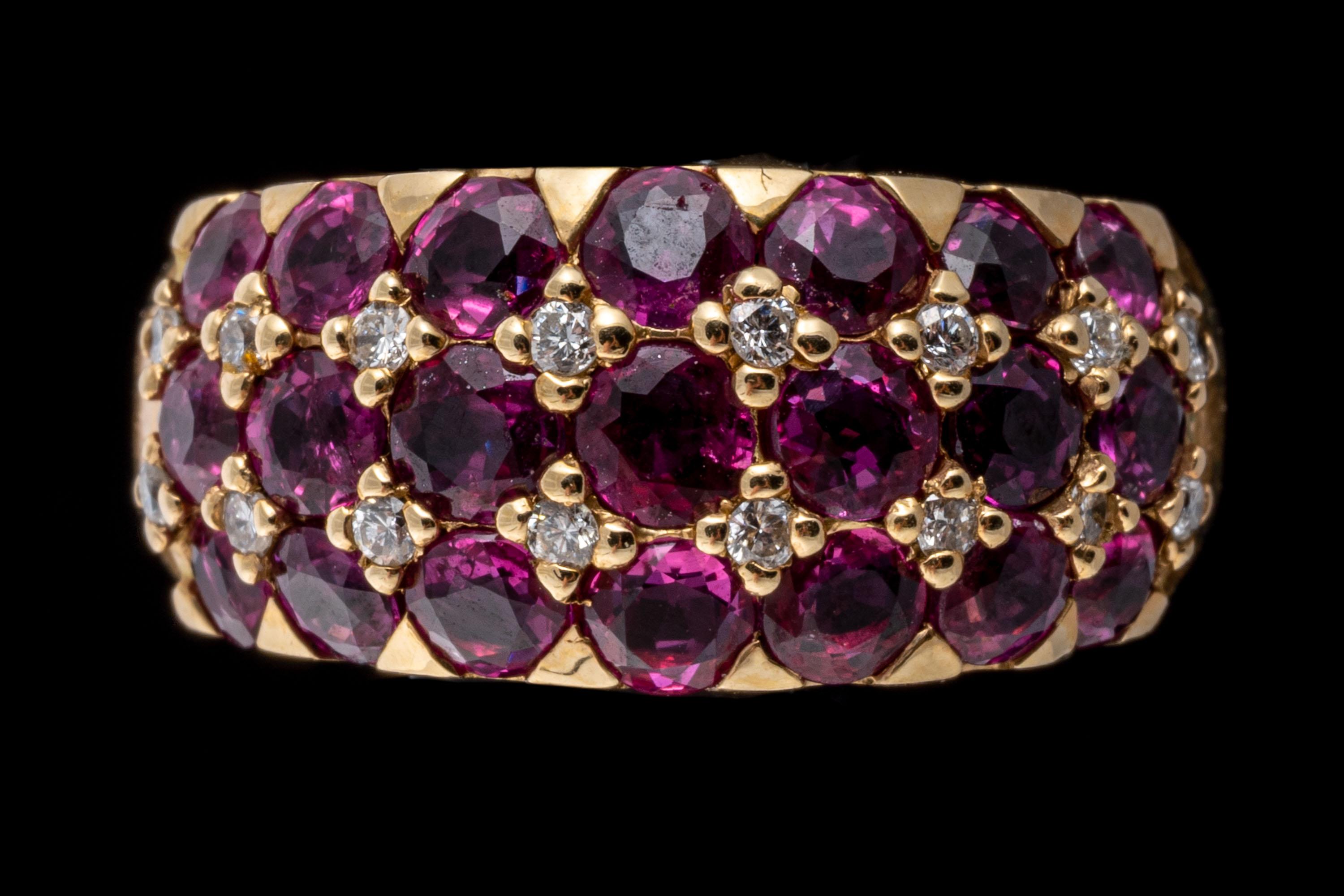 14k yellow gold ring. This gorgeous ring is a five row, bombe dome style, featuring three rows of round faceted, reddish pink color rubies, approximately 3.12 TCW, prong set, alternating with rows of round faceted diamonds, approximately 0.08 TCW,