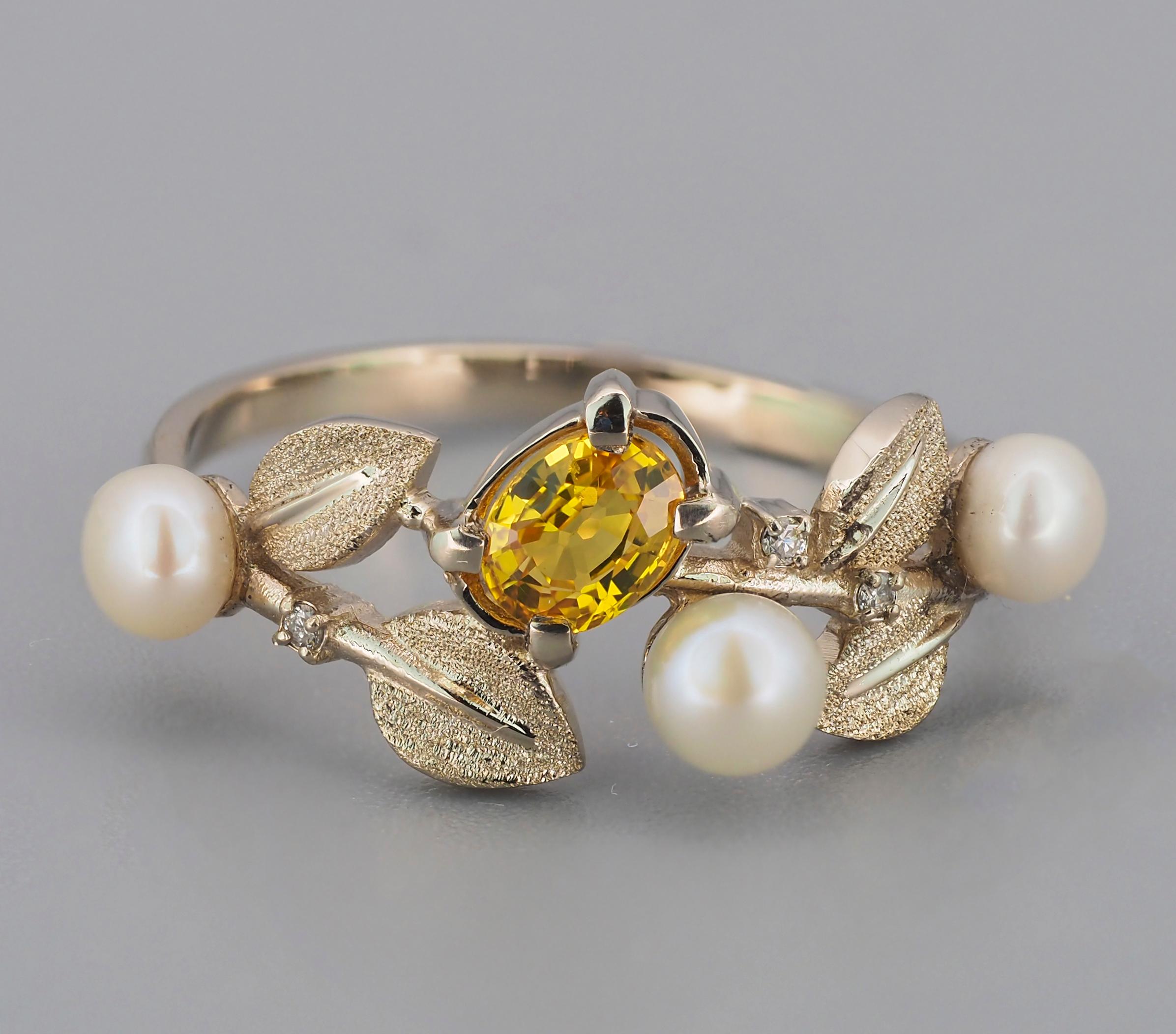 14 kt solid gold Floral ring with natural sapphire, diamonds and pearls. September birthstone.
Weight: 1.8 g.

Central stone: Natural sapphire
Cut: Oval
Weight: approx 0.80 ct.
Color: Light yellow
Clarity: Transparent with inclusions (See in