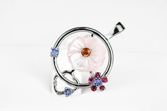 Flower pendant with colored gemstones in 14k gold