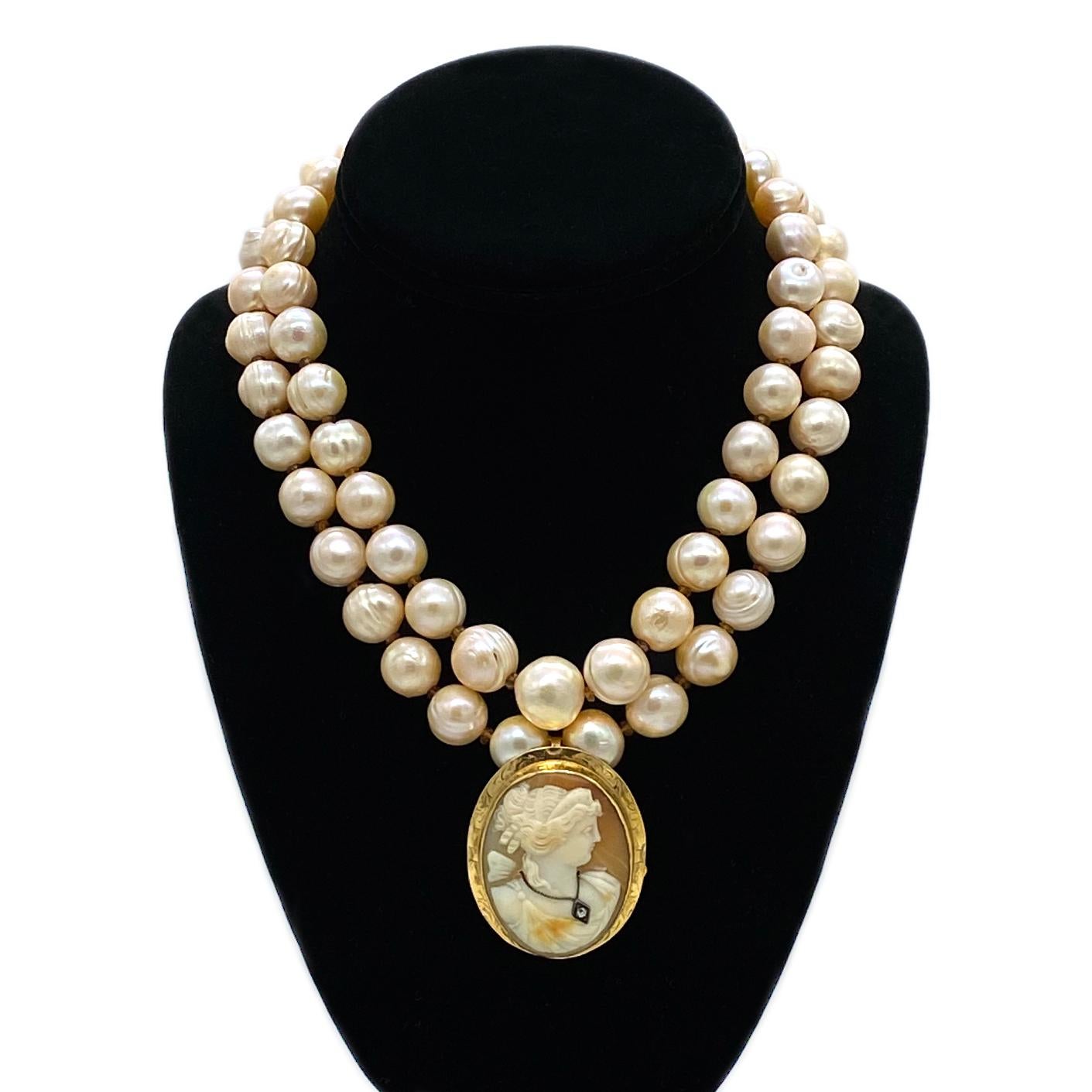 This is an cameo clip on baroque pearl necklace. This double strand necklace was created with up to 15mm peach tone baroque pearls and 14K gold filled components. We added a new solid 14K gold clasp on this late 1890 diamond cameo brooch (1.5 x 1.88