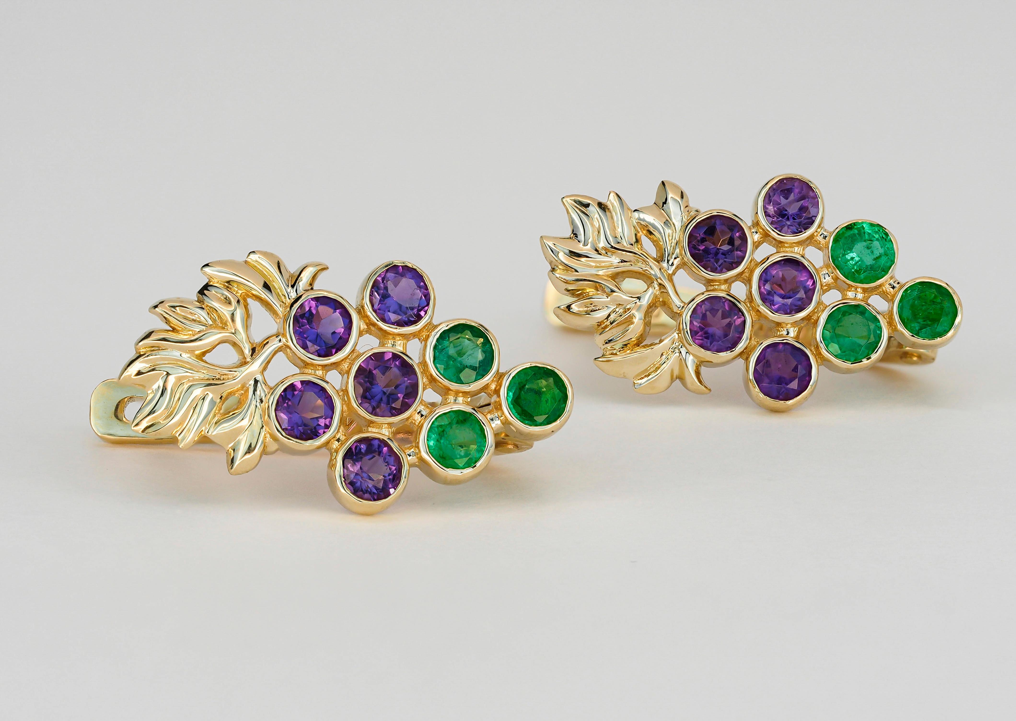 14 kt solid gold earrings with natural emeralds and amethysts. Grape design earrings. May birthstone. February birthstone.
Weight: 3.1 g. 
Size:17.5 x 10 mm.
14k gold - tested 
Gemstones:
Natural emeralds: 6 pieces, color - green
Round cut, weight -