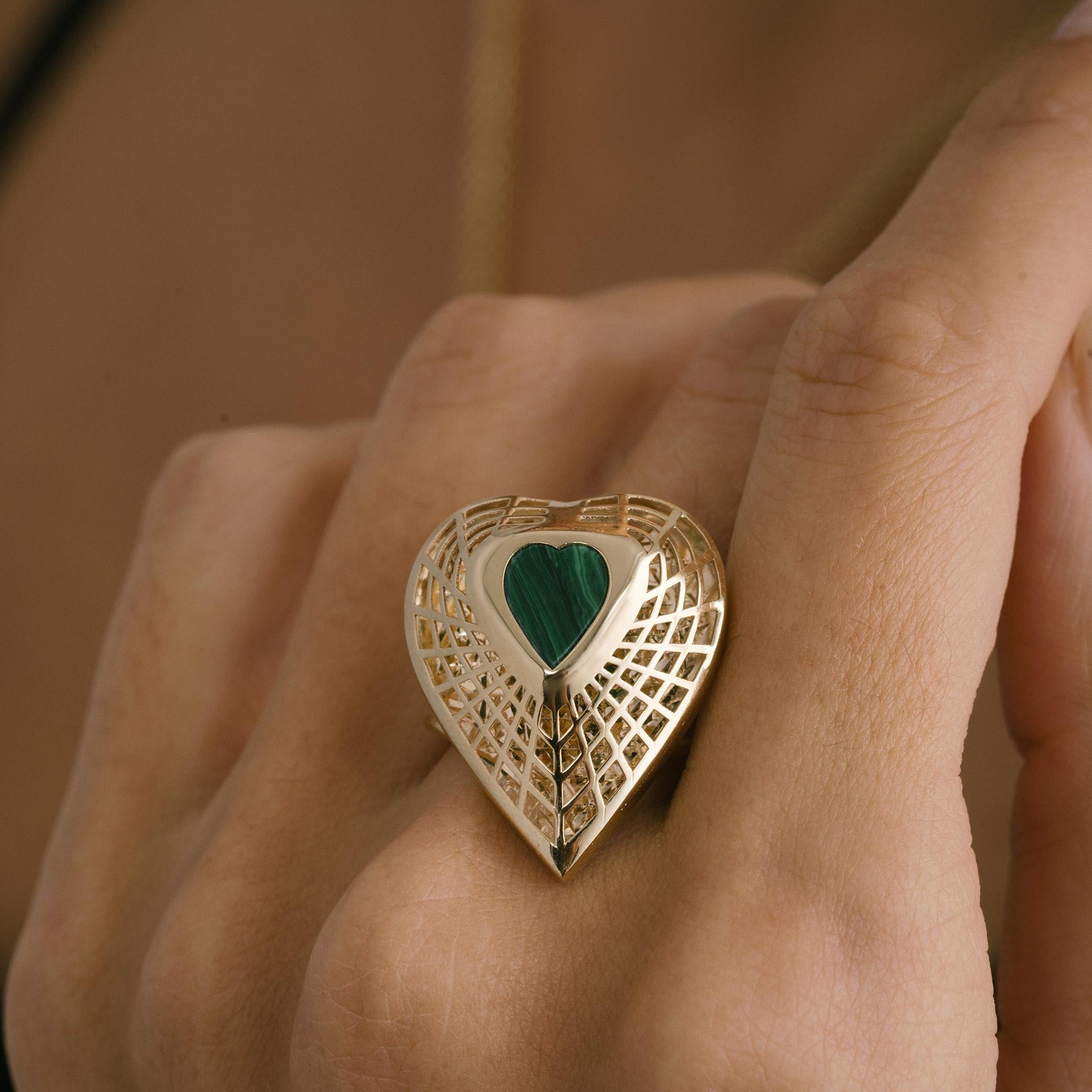 This 14K gold heart ring with natural malachite blends romance, symbolism and artisanal craftsmanship in a timeless design. A polished solid gold frame surrounds a vivid heart-shaped malachite cabochon, celebrated for its deep green tones and unique