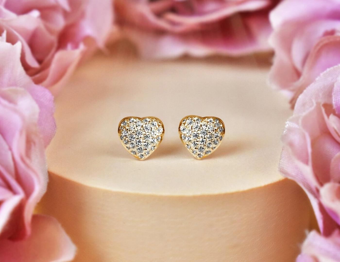 Heart Shaped Diamond Earrings in 14k Rose Gold, Yellow Gold, White Gold.

These Dainty Stud Earrings are made of 14k solid gold featuring shiny brilliant round cut natural diamonds set by master setter in our studio. Simple but unique, elegant and