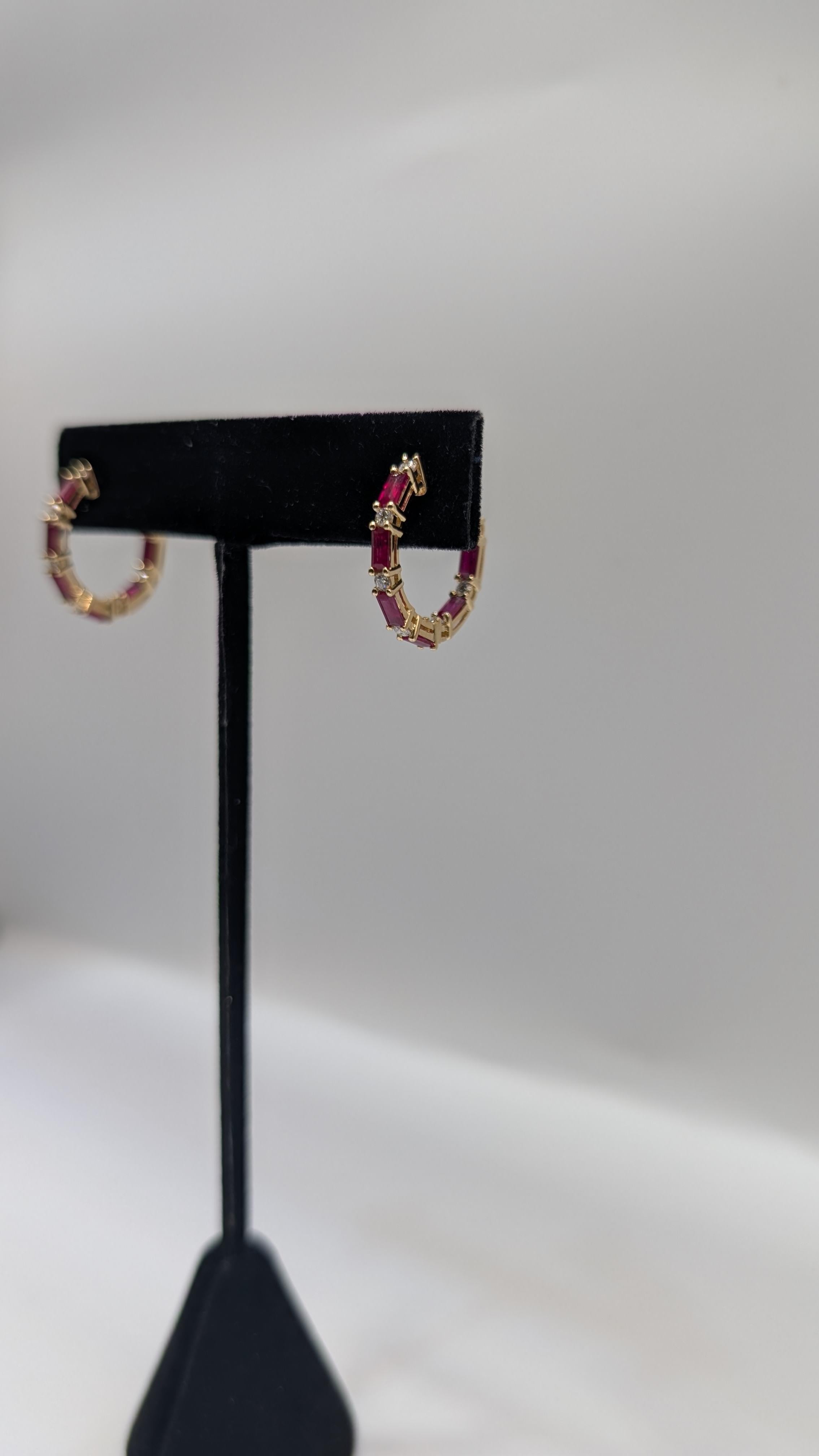 Round Cut 14k Gold Hoop Earrings with .50ct in round diamonds and 1.90ct emerald cut Ruby For Sale