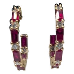 14k Gold Hoop Earrings with .50ct in round diamonds and 1.90ct emerald cut Ruby