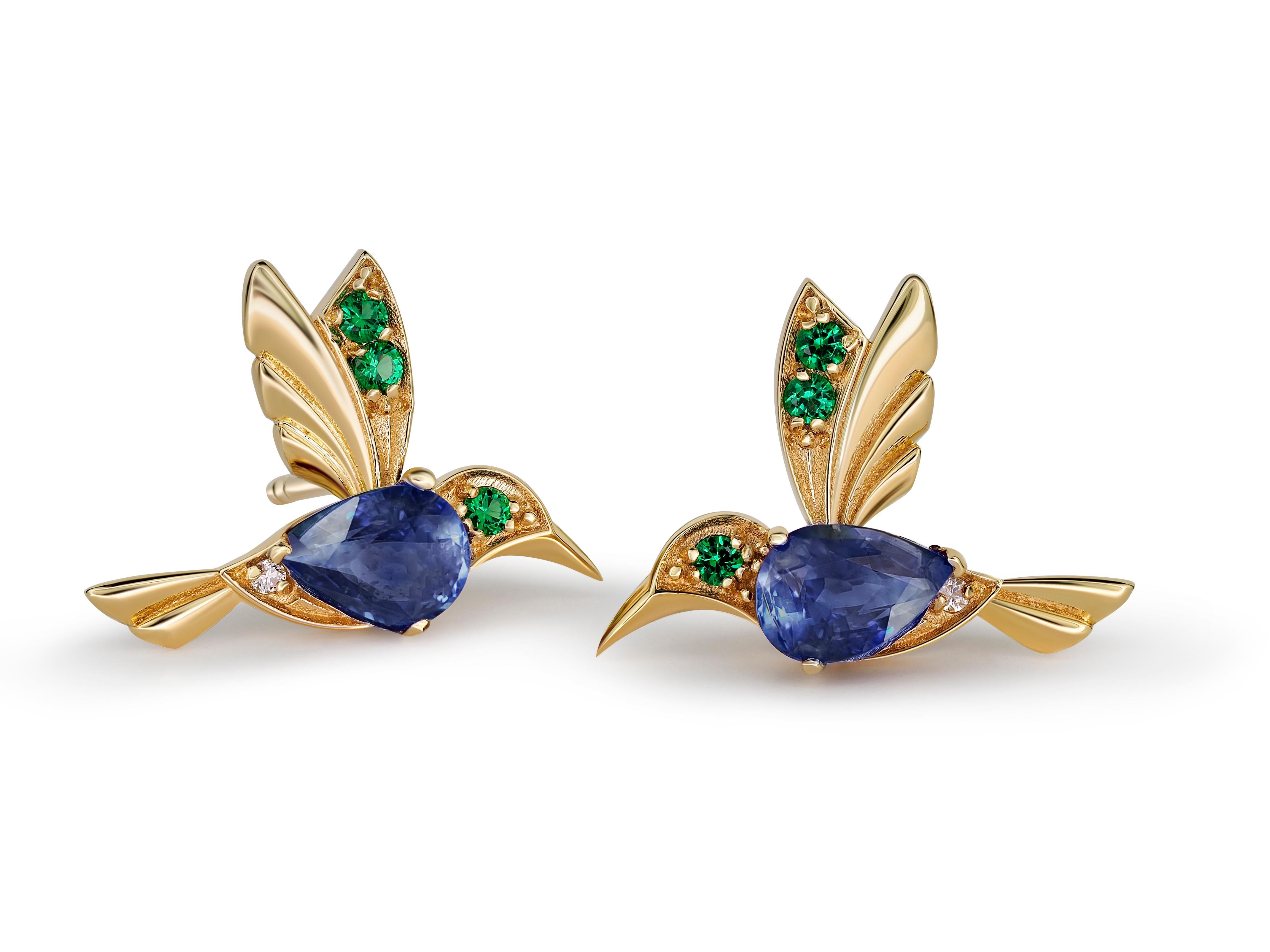 14k Gold Hummingbird Earings Studs with Sapphires. 
Sapphire Bird Stud Earrings. Bird Stud Earrings with gems. Pear sapphire earrings.

Metal: 14 karat gold
Weight: 1.95 g.
Size: 11.73 x 15.85 mm.

Central stones: Genuine sapphires
Cut: 