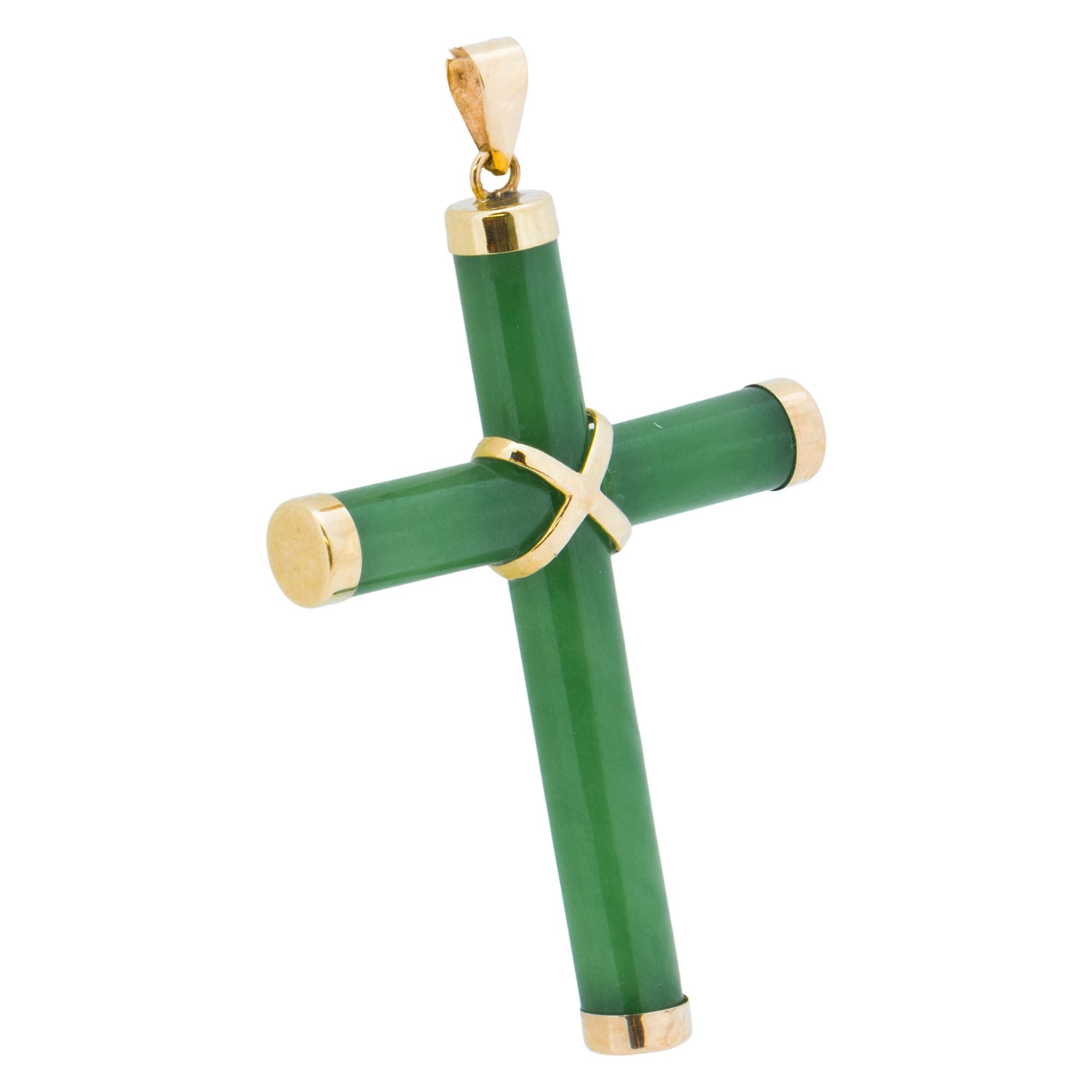14K yellow gold and jade cross pendant. Gold endcaps on jade, gold jump ring, and gold 