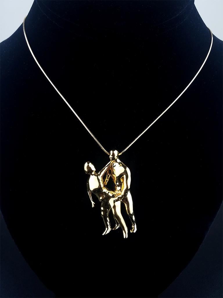 Polished 14k Solid Gold.

Kotch is known as a Caribbean term represented in dance. Drawing from that notion and his Caribbean roots Nicholas Moore created this piece representing dance, love, joy, and companionship.

Crafted in a warm 14k solid