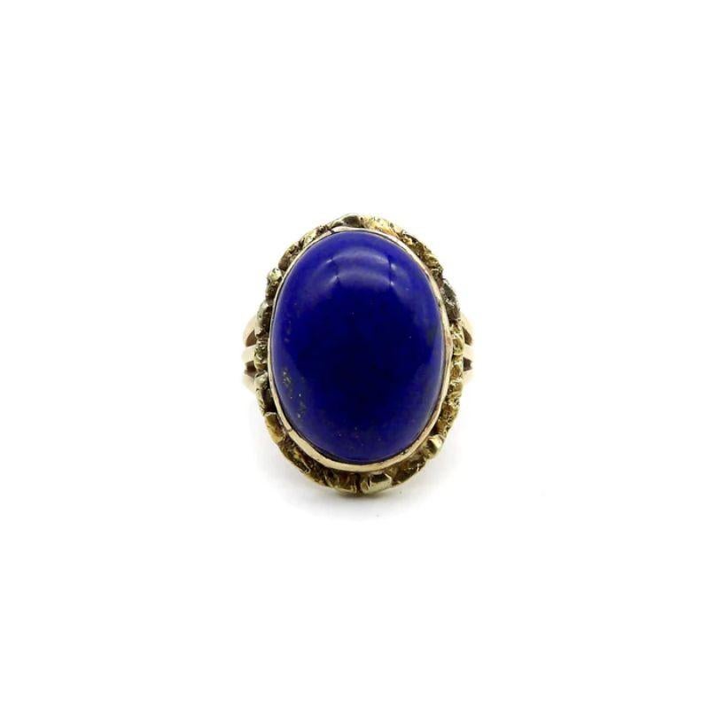 A vivid blue lapis cabochon is bezel set into a halo of 22k gold nuggets. The stone is a deep, well-saturated cobalt blue, while the gold nuggets bring richness and texture to the surface of the ring. The effect is stunning, and the two elements
