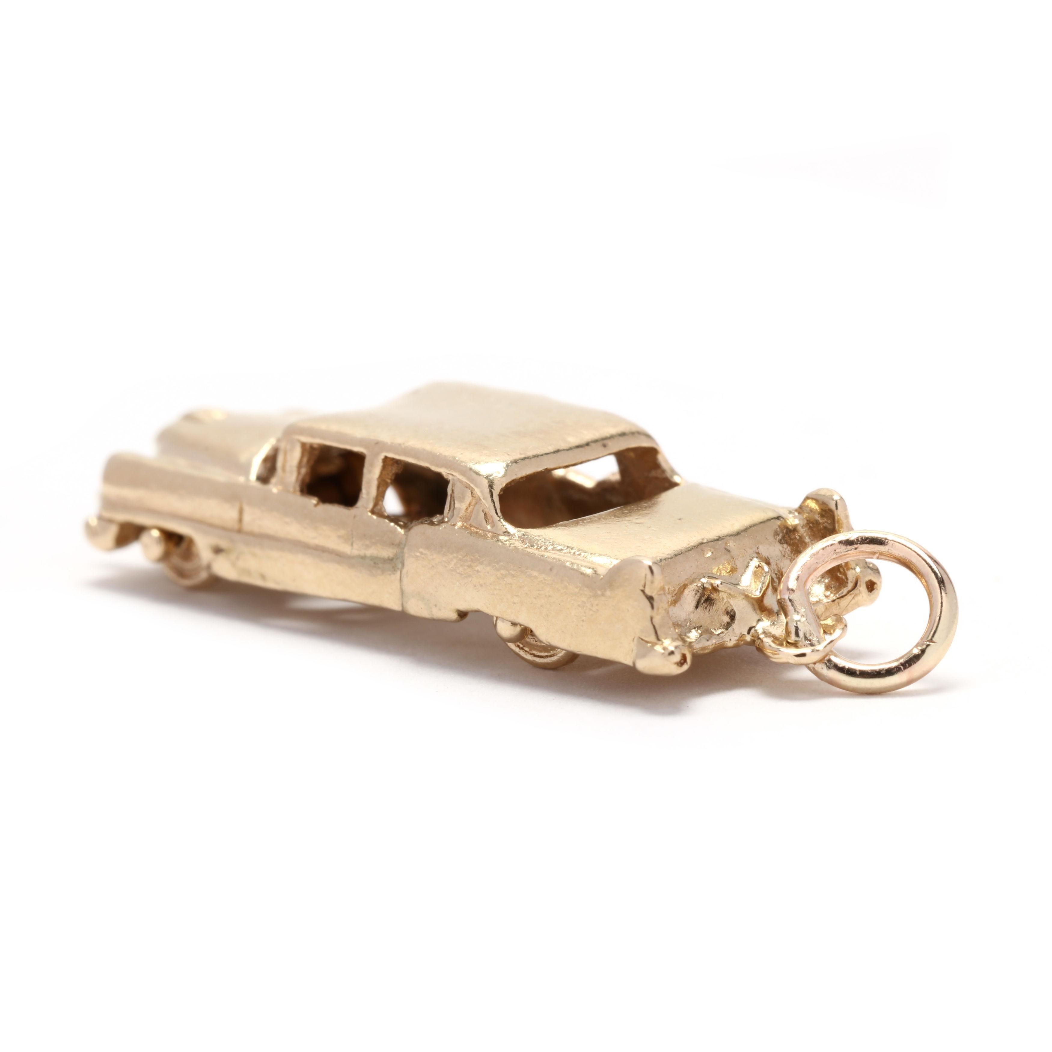 A vintage 14 karat yellow gold large car charm with spinning wheels.



Length: 1 3/8 in.



Width: 7/16 in.



Weight: 3.8 dwts.