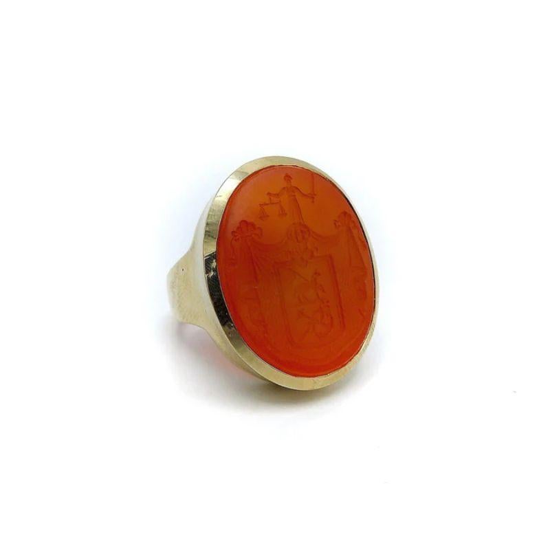 This is a spectacular carved carnelian 14 karat gold signet ring. It is part of Kirsten's Corner signature line.  Starting with a beautifully carved carnelian intaglio a simple but sophisticated 14 karat gold bezel set mount was designed.  The
