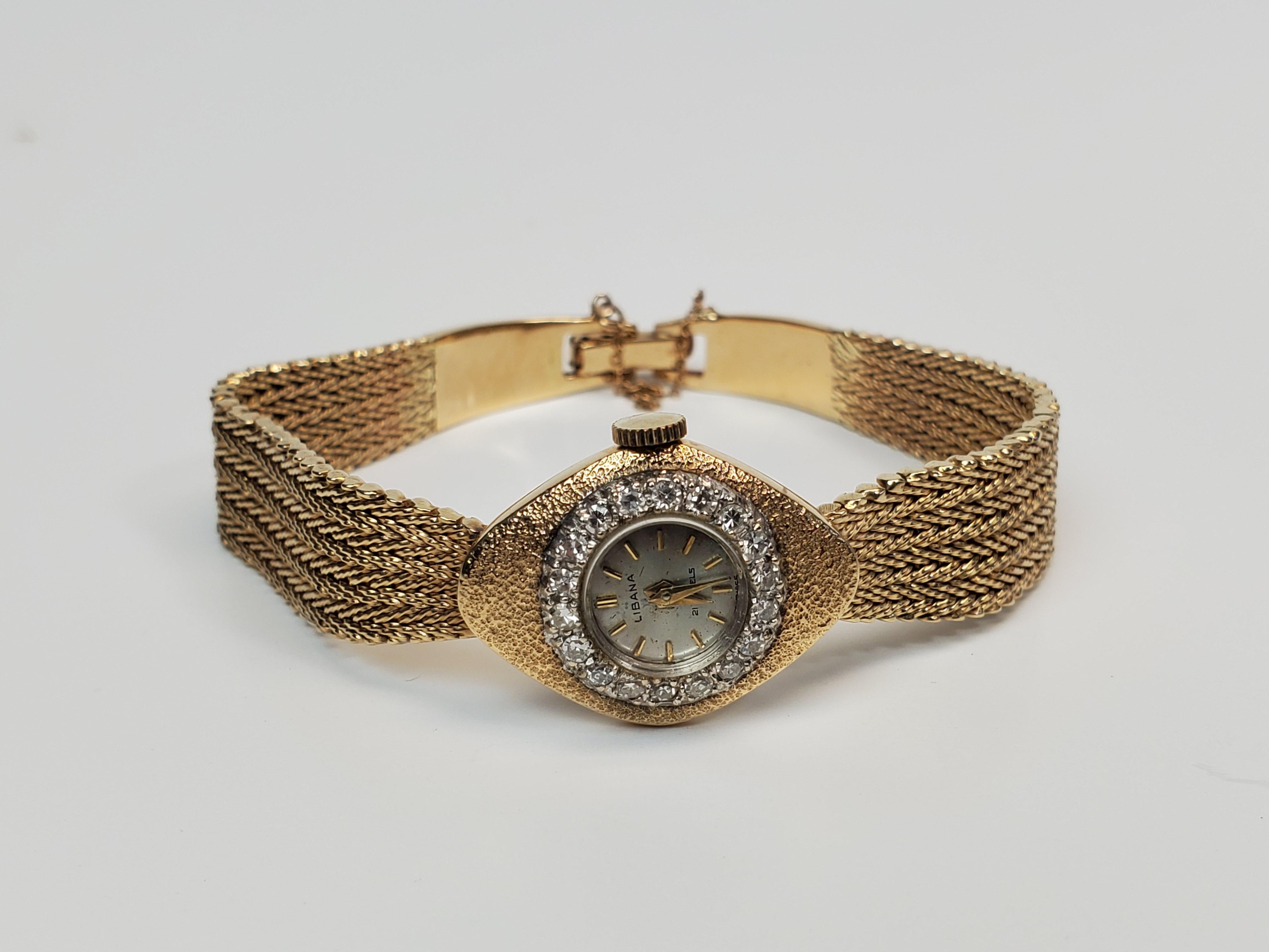 14K Gold Libana ladies wristwatch with diamond bezel around watch face.