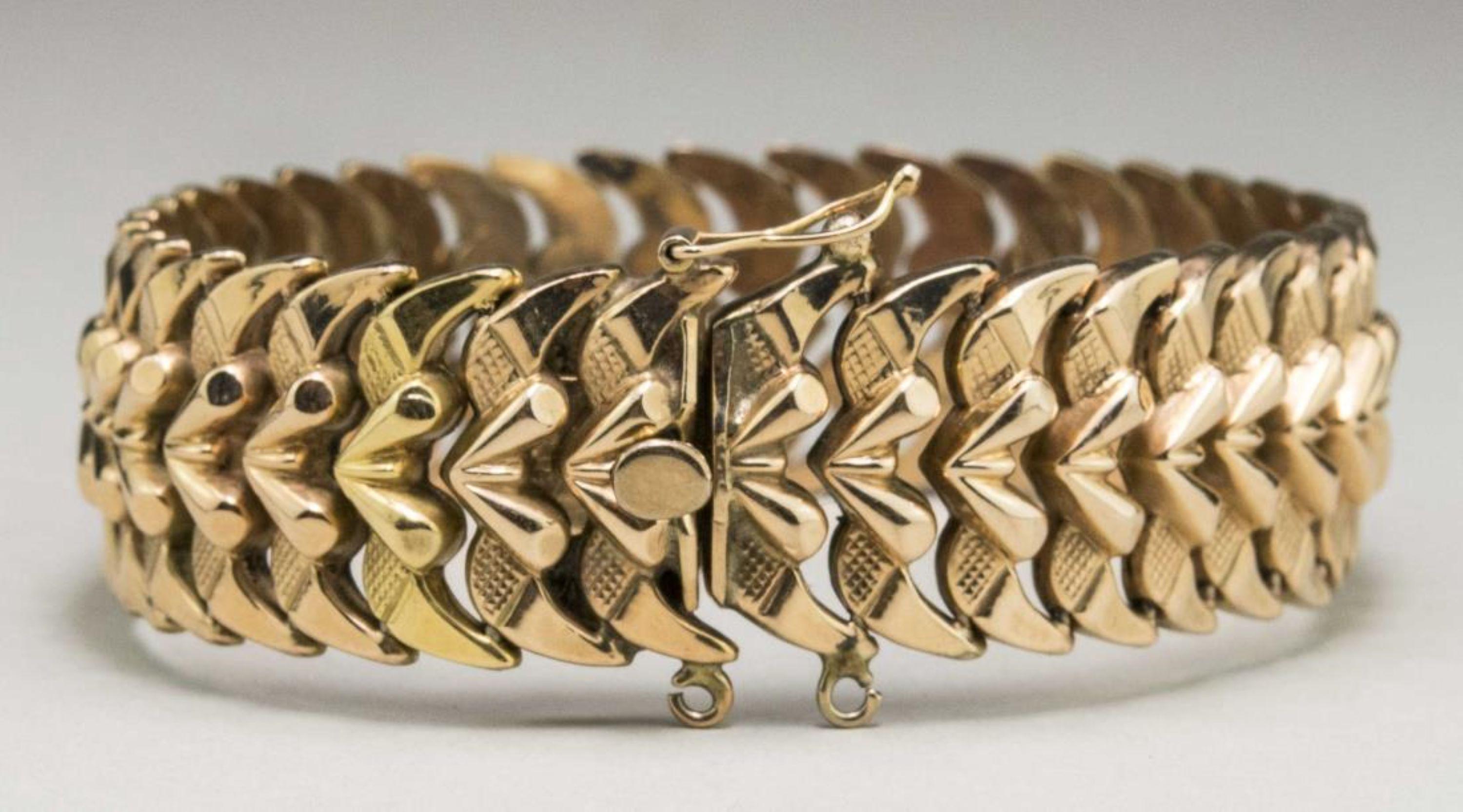 14k yellow gold fancy link bracelet. Length 7 1/2 inches, width 3/4 inch, 28.5 grams.