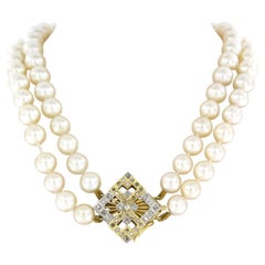 14k gold lock with single cut diamonds up to 0.86ct with two row pearl necklace