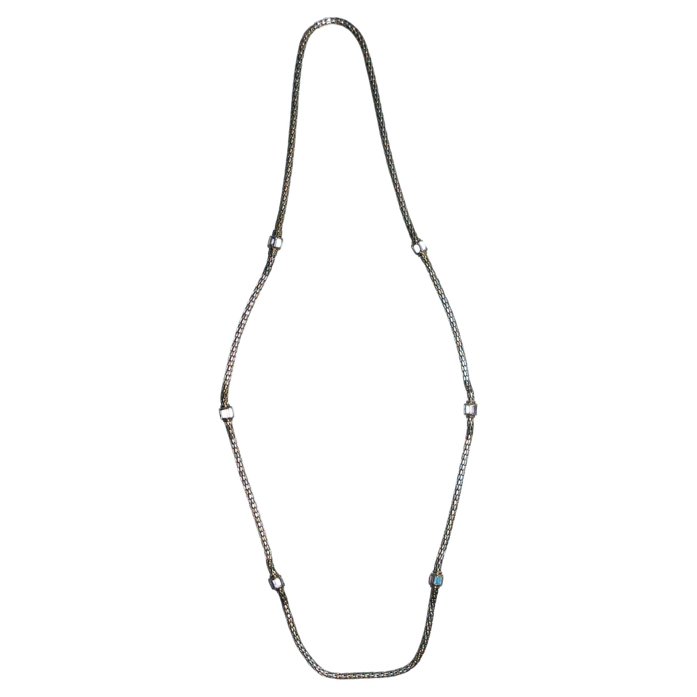 Wonderful vintage crafted of 14k yellow gold necklace, about 36 inch long has the look of a mesh chain, but is actually made up of sturdy tiled lengths that give the necklace lots of fluidity and movement.  Accented with aquamarine and amethyst