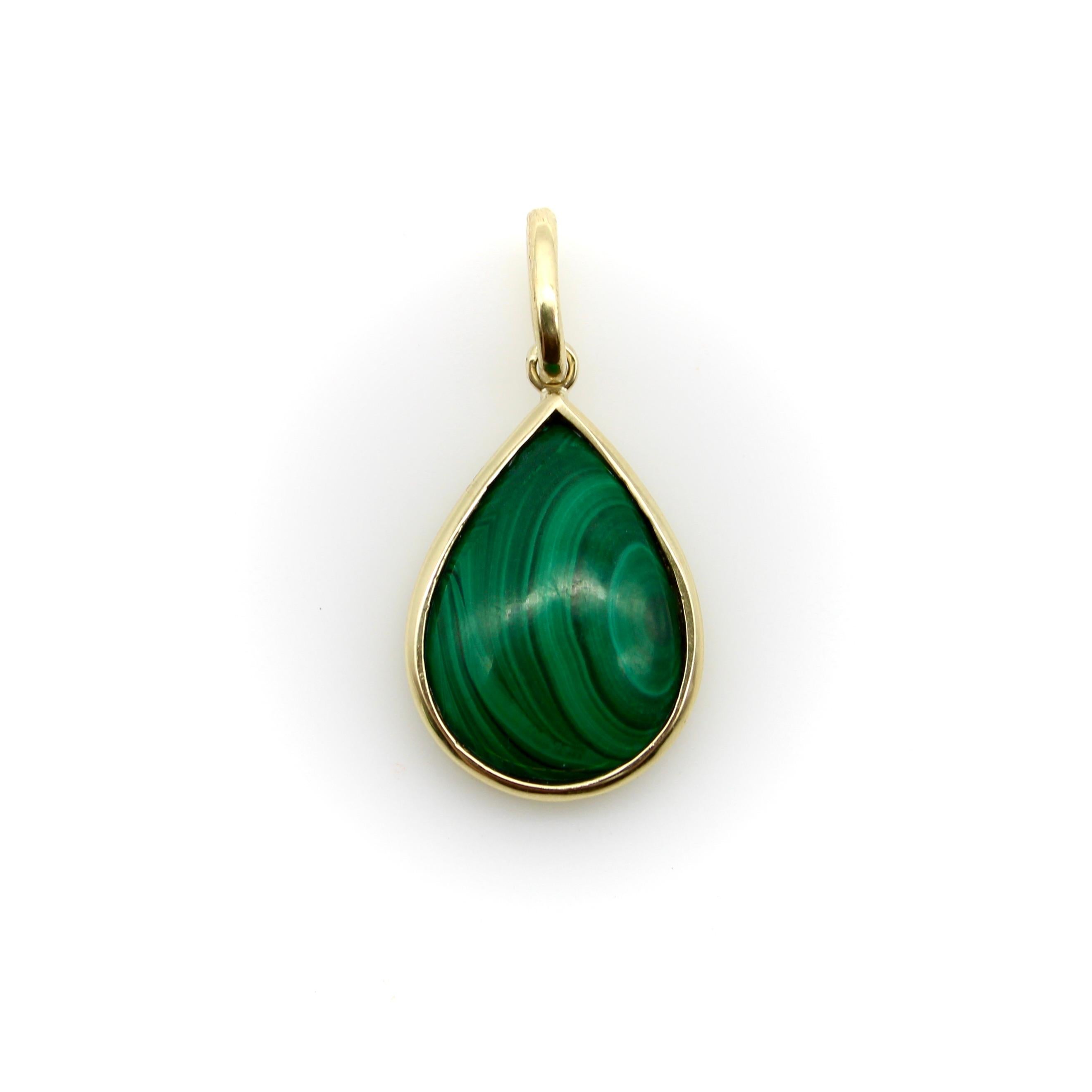 A sweet signature piece by Kirsten’s Corner, this pear-shaped malachite cabochon has been carefully bezel set in 14k gold. The malachite has beautiful patterning—hues of green spiral and come together in a bull’s eye near the edge of the stone. The