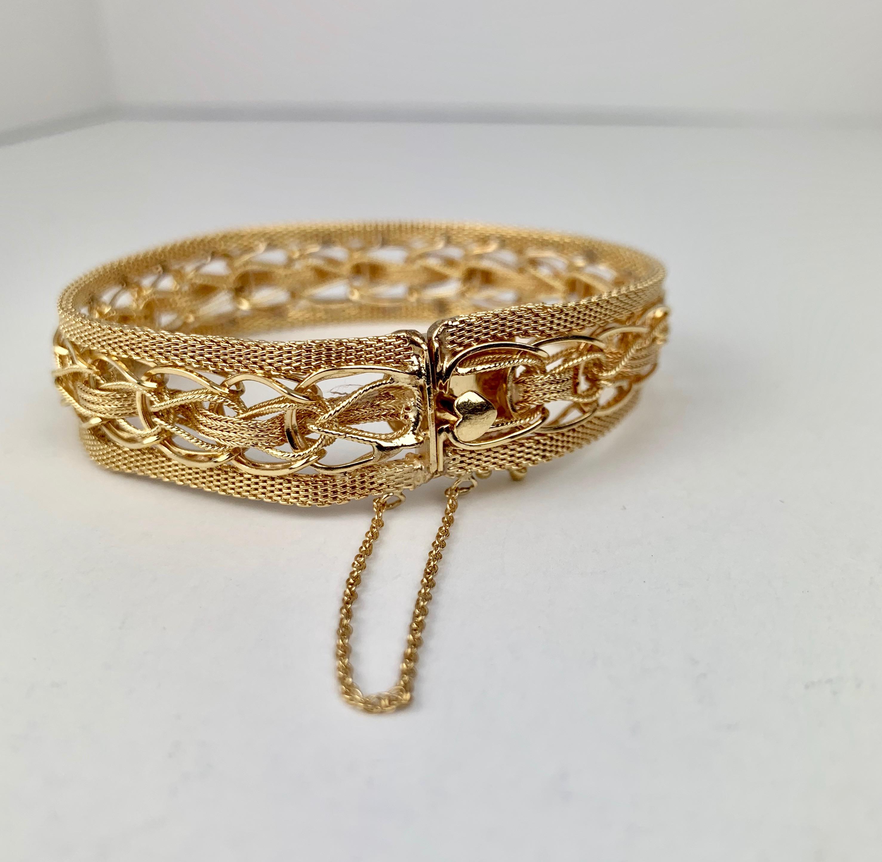 Contemporary Gold Mesh Bracelet with a Heart Shaped Thumb Latch-14 karat y.g.  For Sale