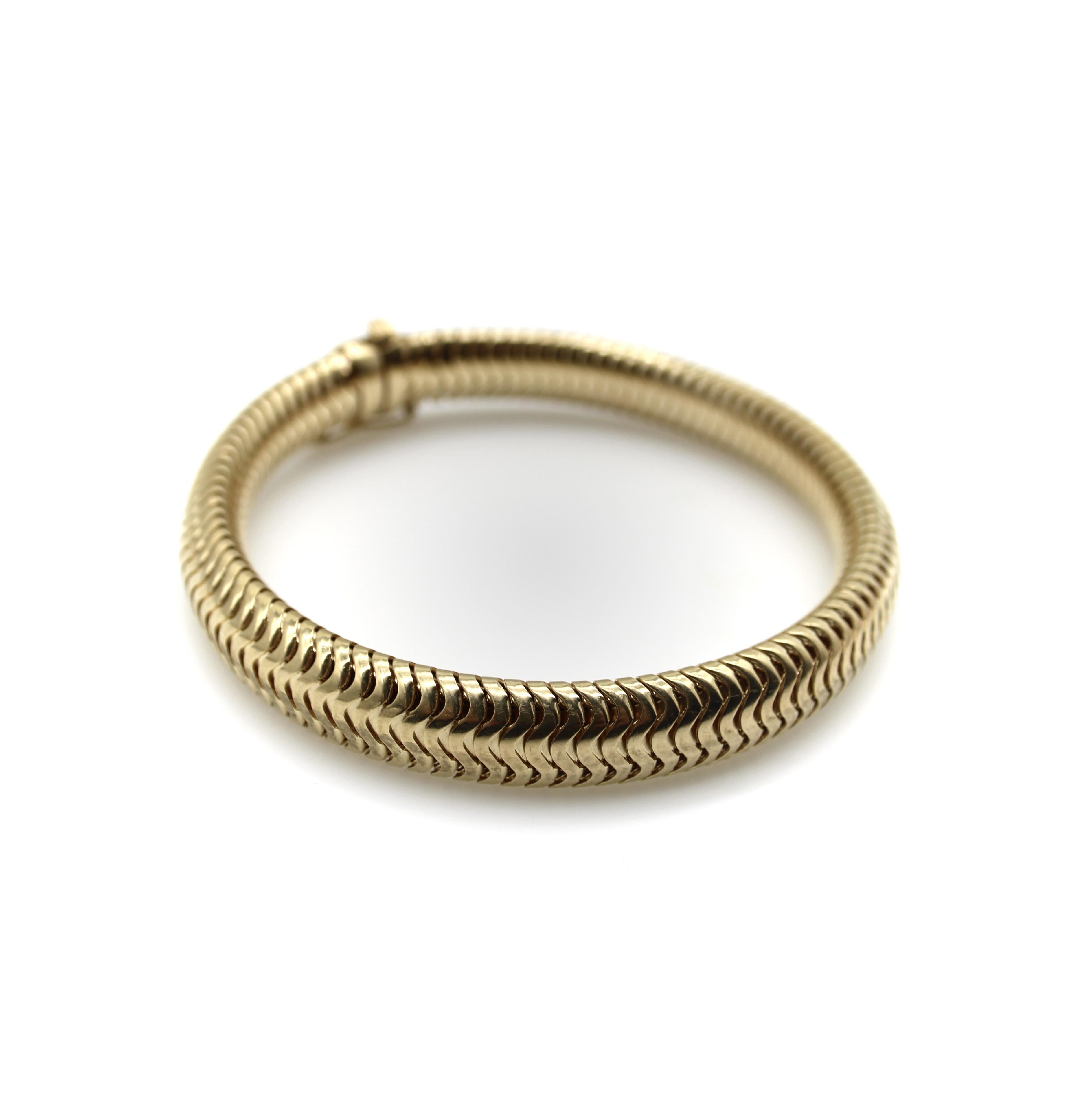 This 14k gold snake chain has a beautiful fluid quality and mesmerizing pattern within the links. It is a luxurious weight, with a sleek and slinky feel. Because the chain is thick, when you close it on itself, it becomes sturdy and rigid like a