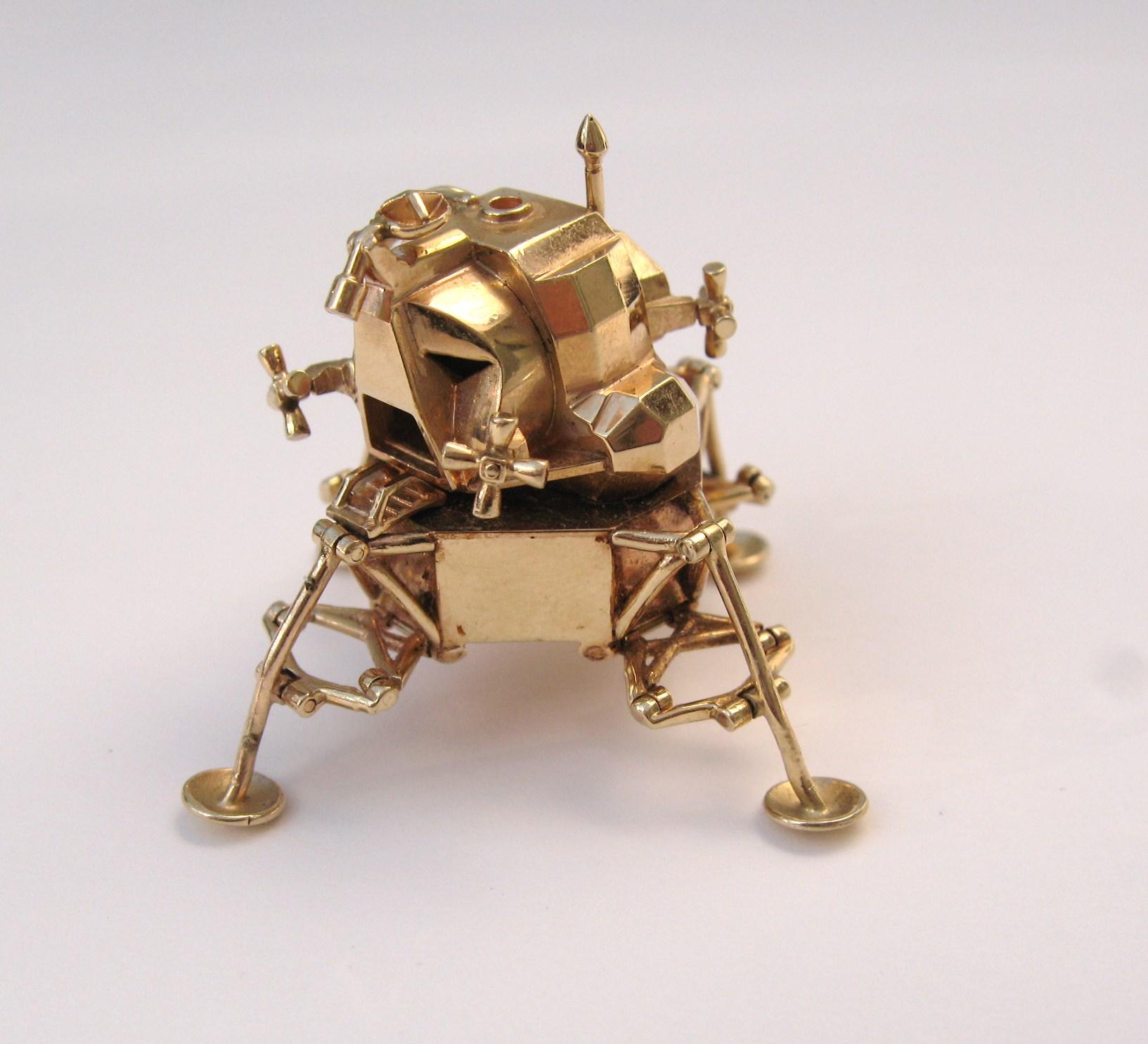 Now, this isn't something you see everyday! 14K Gold model of Apollo 11 articulated Lunar Module, a mini Apollo 11. 1969 Lunar Excursion Module. Measuring 1.5in x 1.5in. The feet of the module articulate out and fold back in. This is out of our