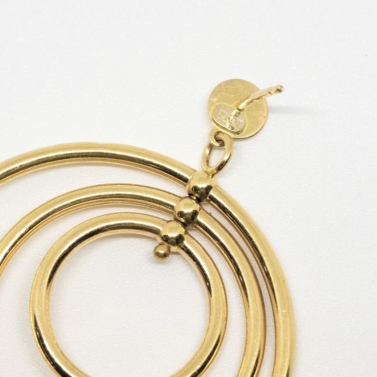 14k yellow gold multi hoop earrings with stud posts.