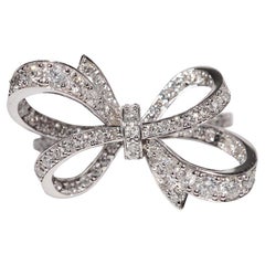 Bague en or 14k ornée d'un nœud et de diamants naturels