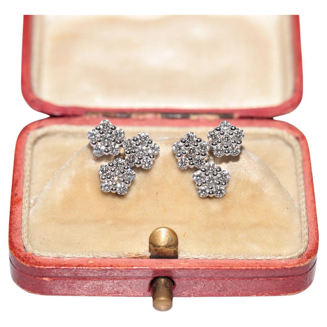 Pendiente de oro de 14 quilates con diseño de flores decoradas con diamantes naturales