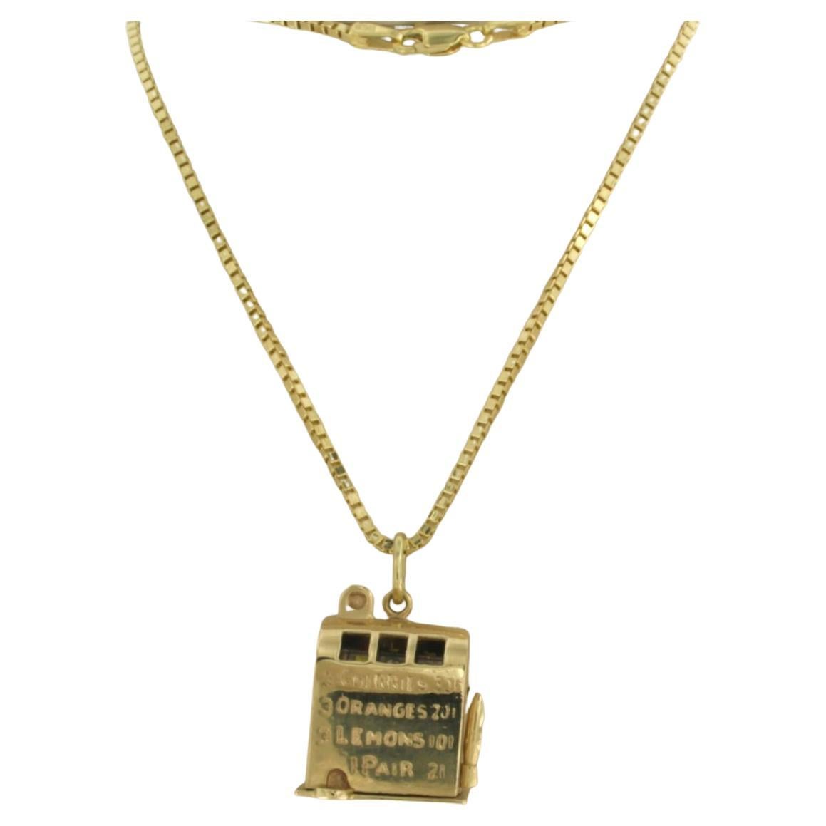 Halskette aus 14k Gold mit einem Anhänger in Form einer Schlitzmaschine - 16,8 Gramm - 50 cm lang im Angebot