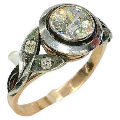 14k gold solitare ring in 2 tone colour centered with old mine cut diamond stone diameter 6.9mm estimate diamond weight 1.20 carats H color vs clearity decorted with 4 old mine cut diamonds on ring sides 
