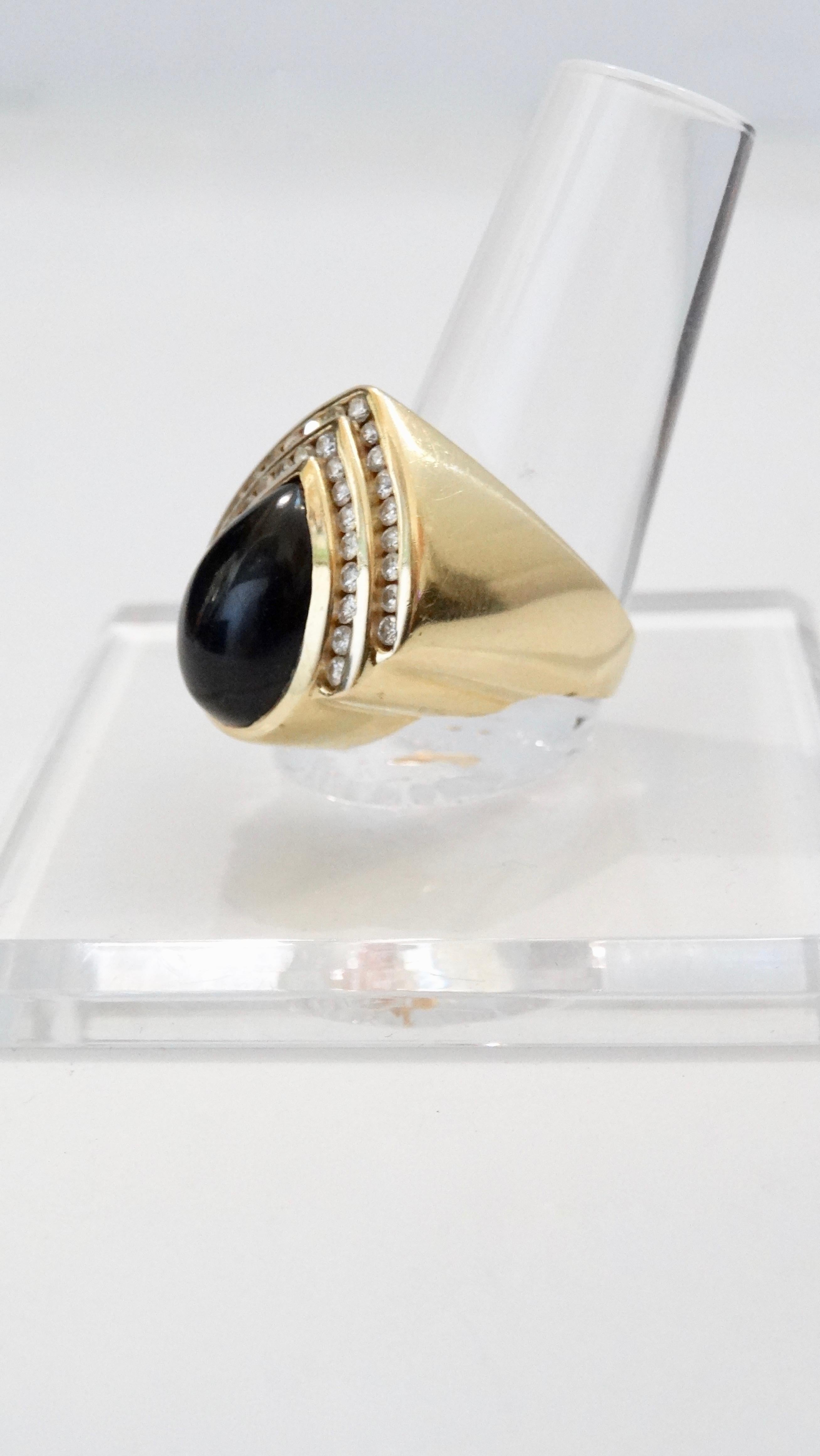 Gorgeous teardrop earring and ring set crafted from 14k Gold and set with an Onyx center stone and two rows of VS1 diamonds. Total weight in grams is 25.27 and ring is a size 7.5. Earrings feature pierced back with a lever closure. Classic and