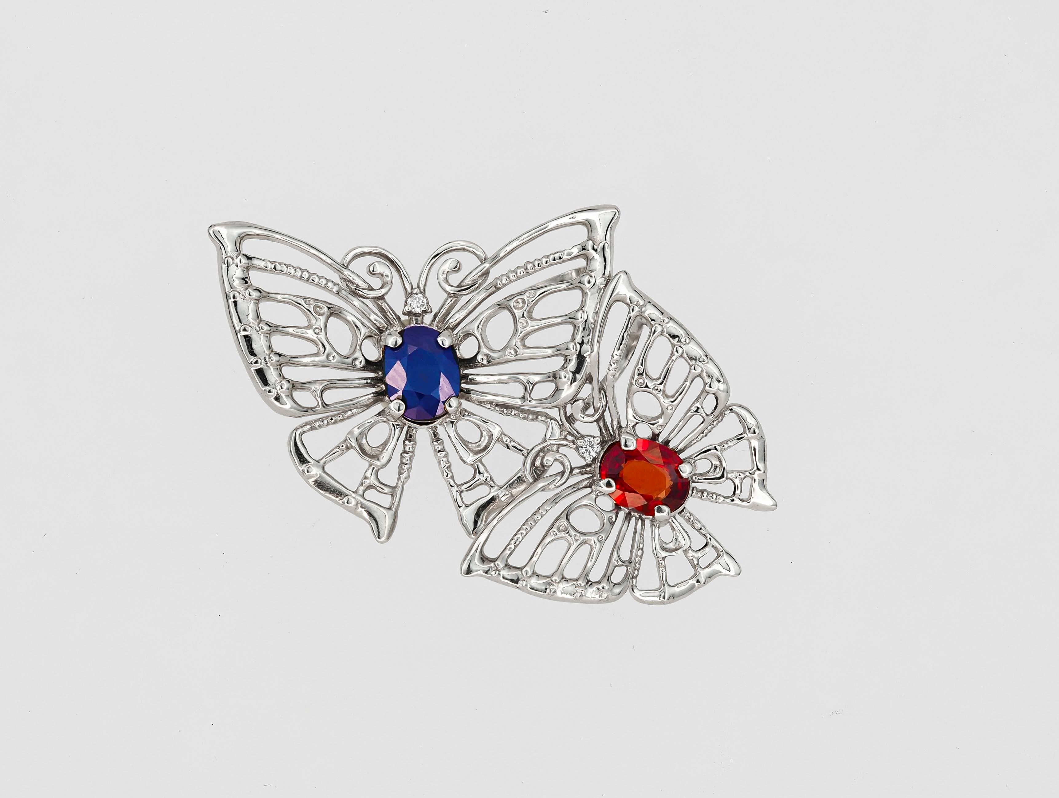 Modern 14k gold pair of butterflies pendant with sapphires and diamonds. For Sale