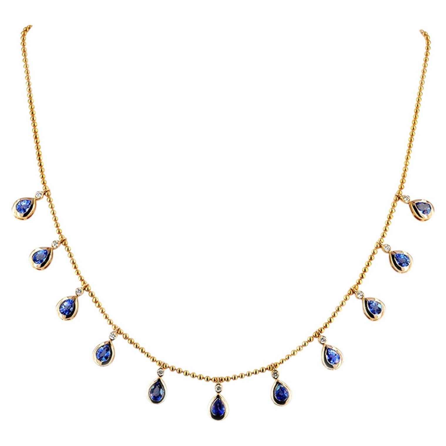 Collana con frangia a pera in oro 14K con zaffiro blu da 4,80 carati e diamante a castone