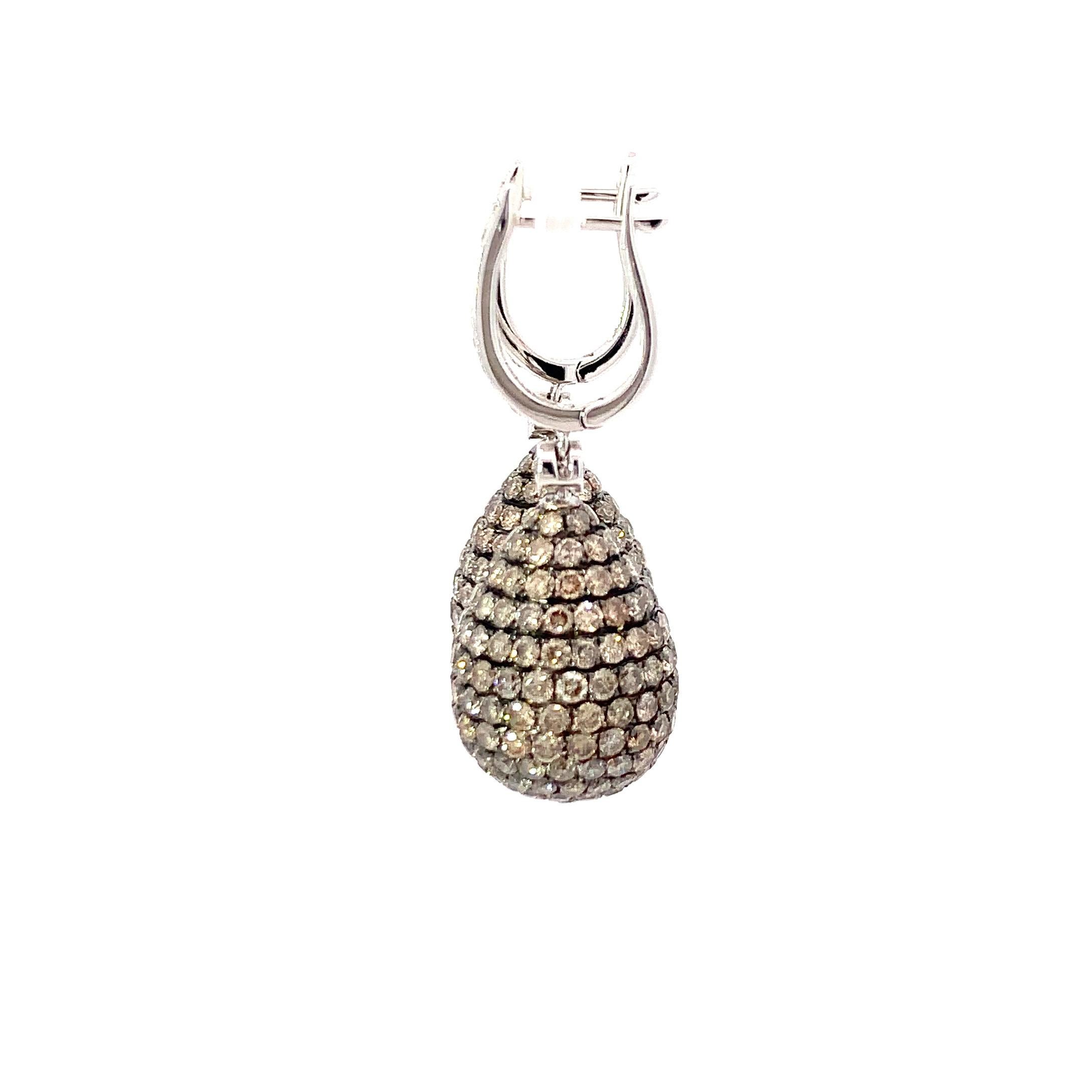 Elevate your elegance with our stunning 14K white gold earrings designed in the form of hanging pears, exuding a graceful and captivating silhouette. These exquisite earrings feature a harmonious interplay of round brown and white diamonds, creating